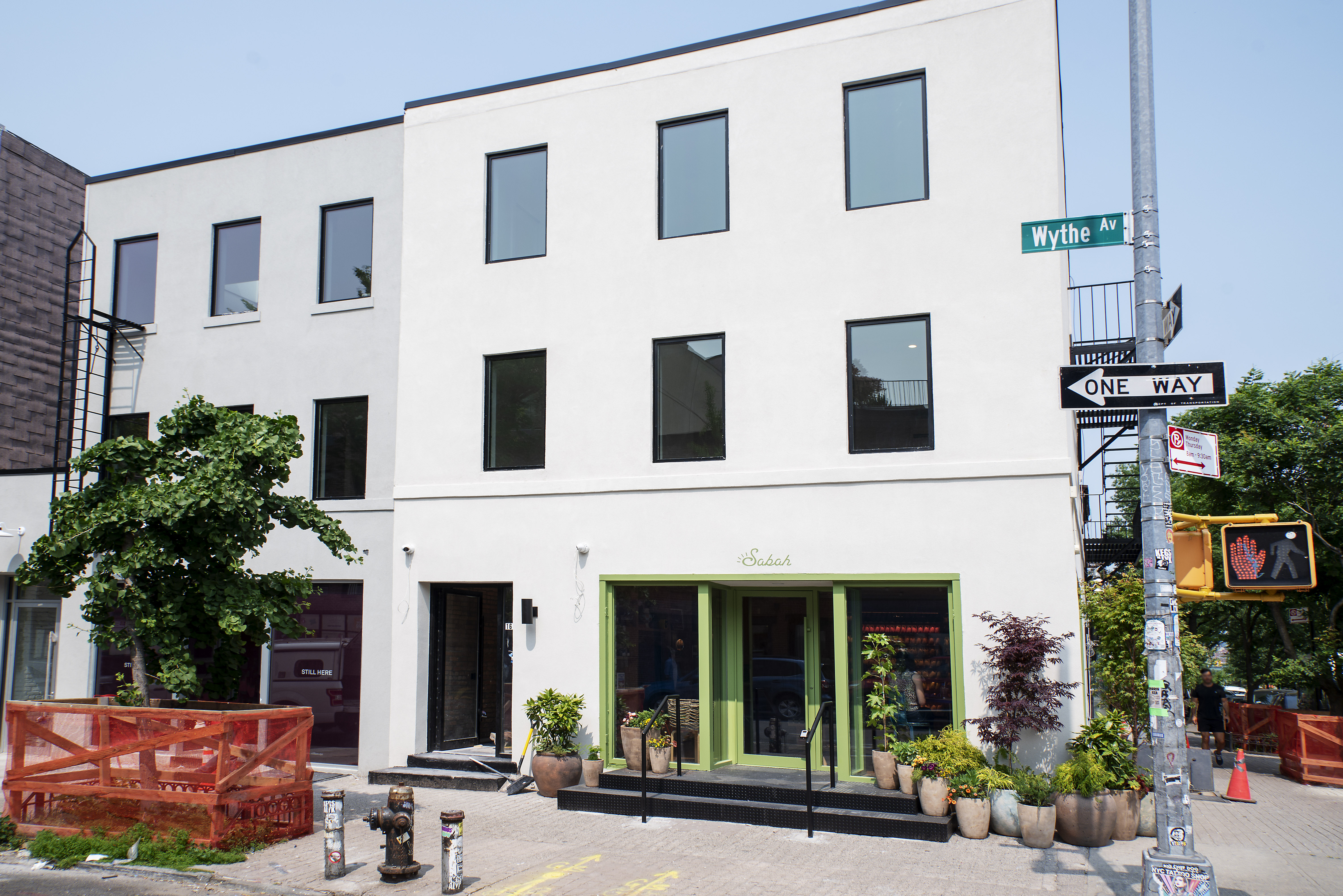 168 Wythe Avenue, Unit 3B Brooklyn, NY 11249 - Photo 1 of 1 a view of a building with a window and potted plants