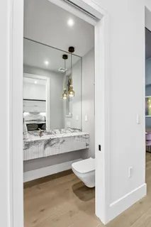 a large bathroom with a large tub and sink