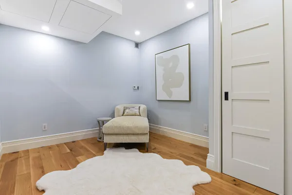 a room with a bed and a window