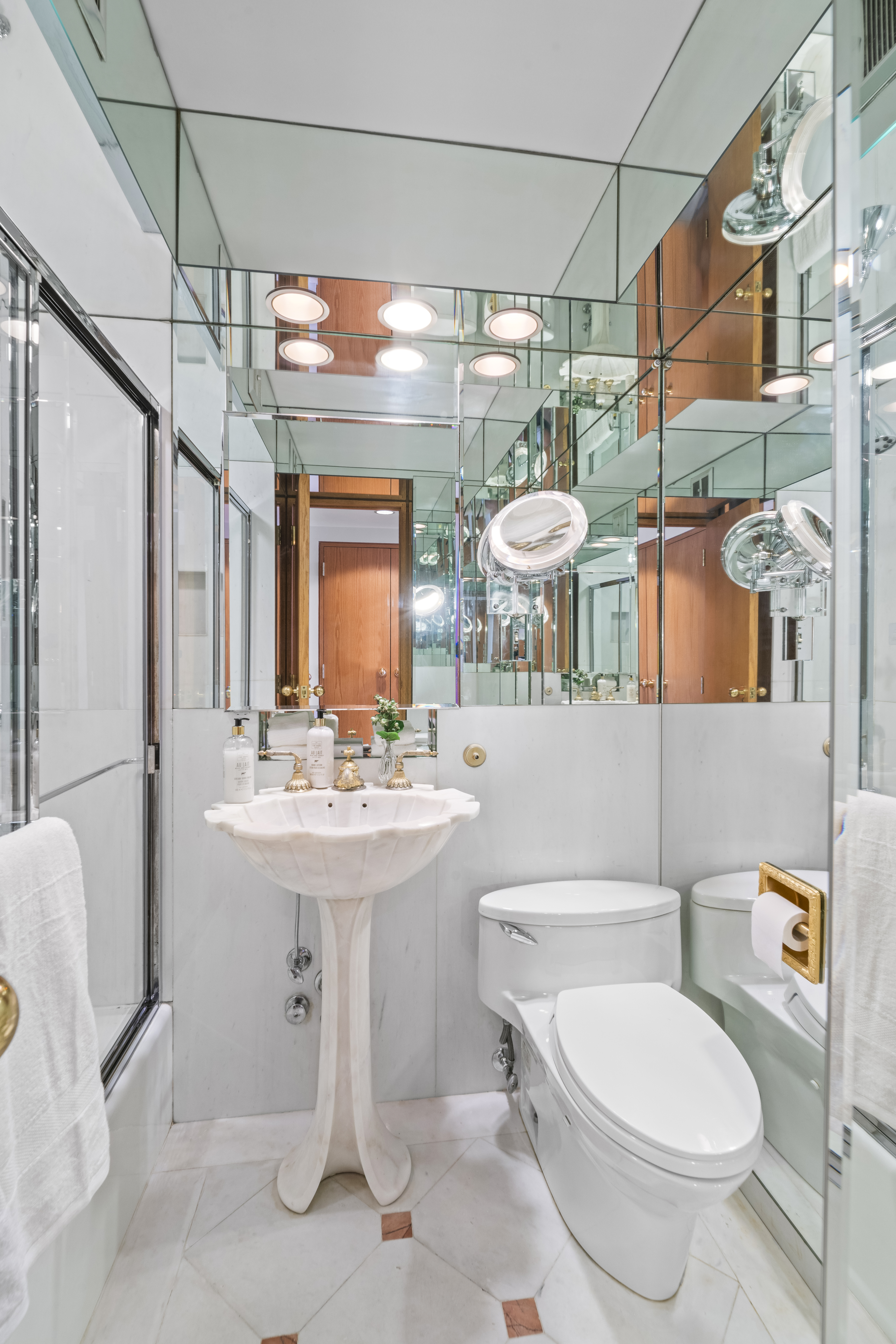120 Central Park South, Unit 6AB Manhattan, NY 10019 - Photo 15 of 17 a bathroom with a sink a toilet and shower