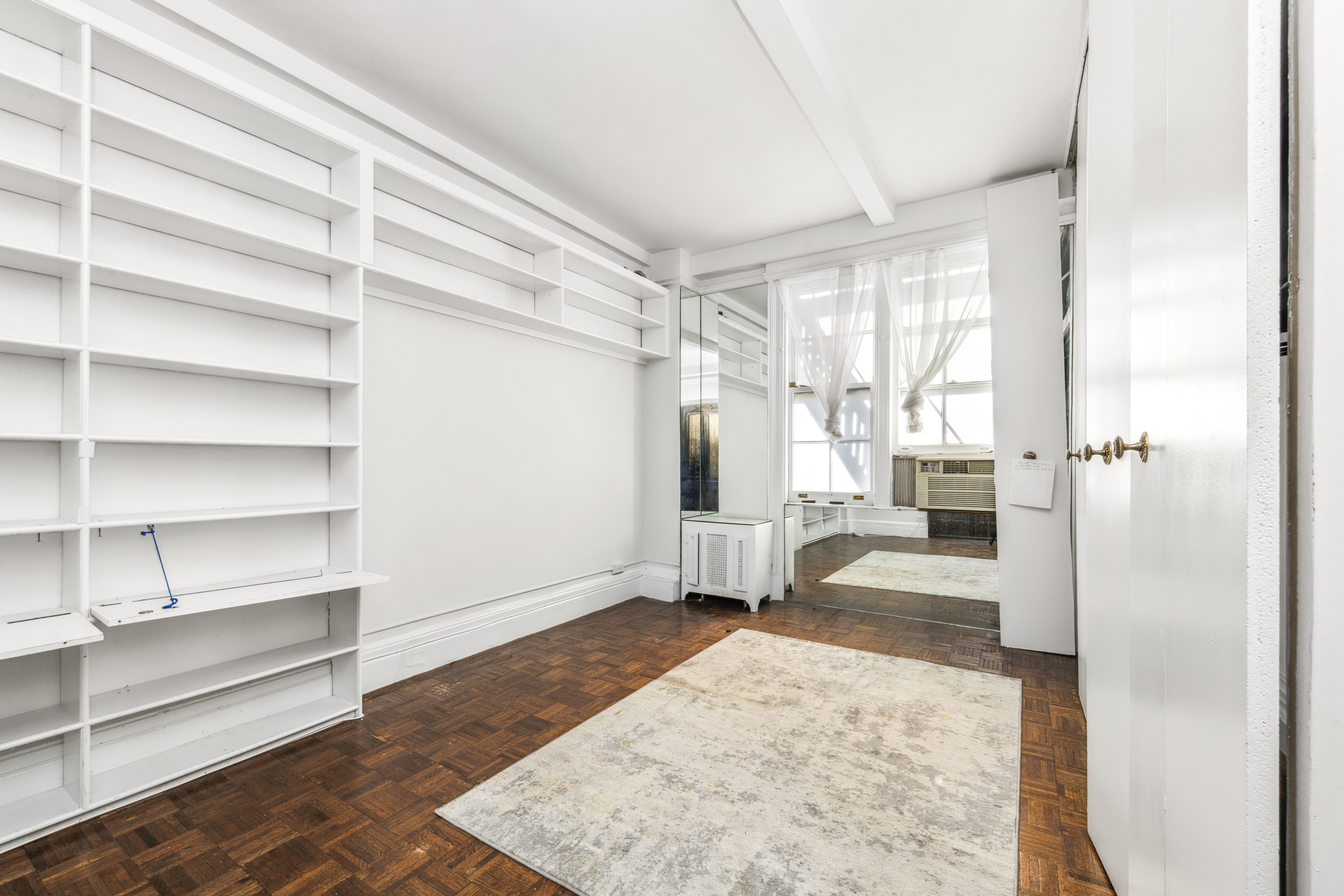 130 East 67th Street, Unit 9C Manhattan, NY 10065 - Photo 16 of 20 a very nice looking room with a large window