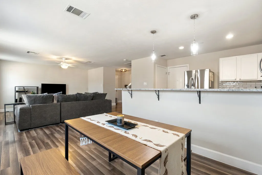 a living room with furniture and a table