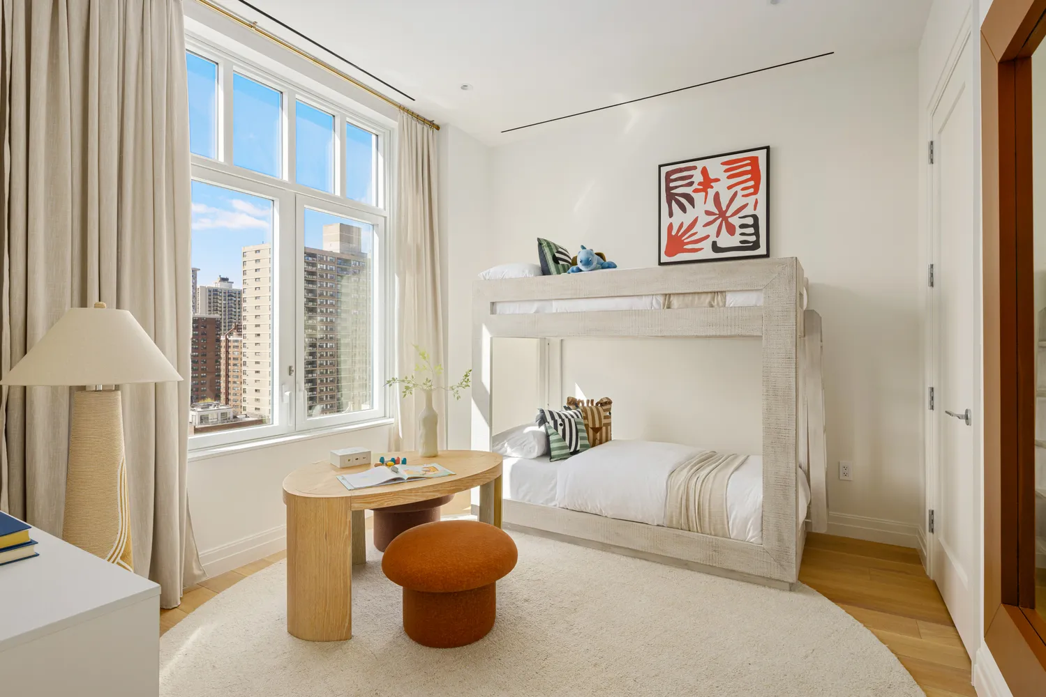 a bathroom with a toilet sink vanity and mirror