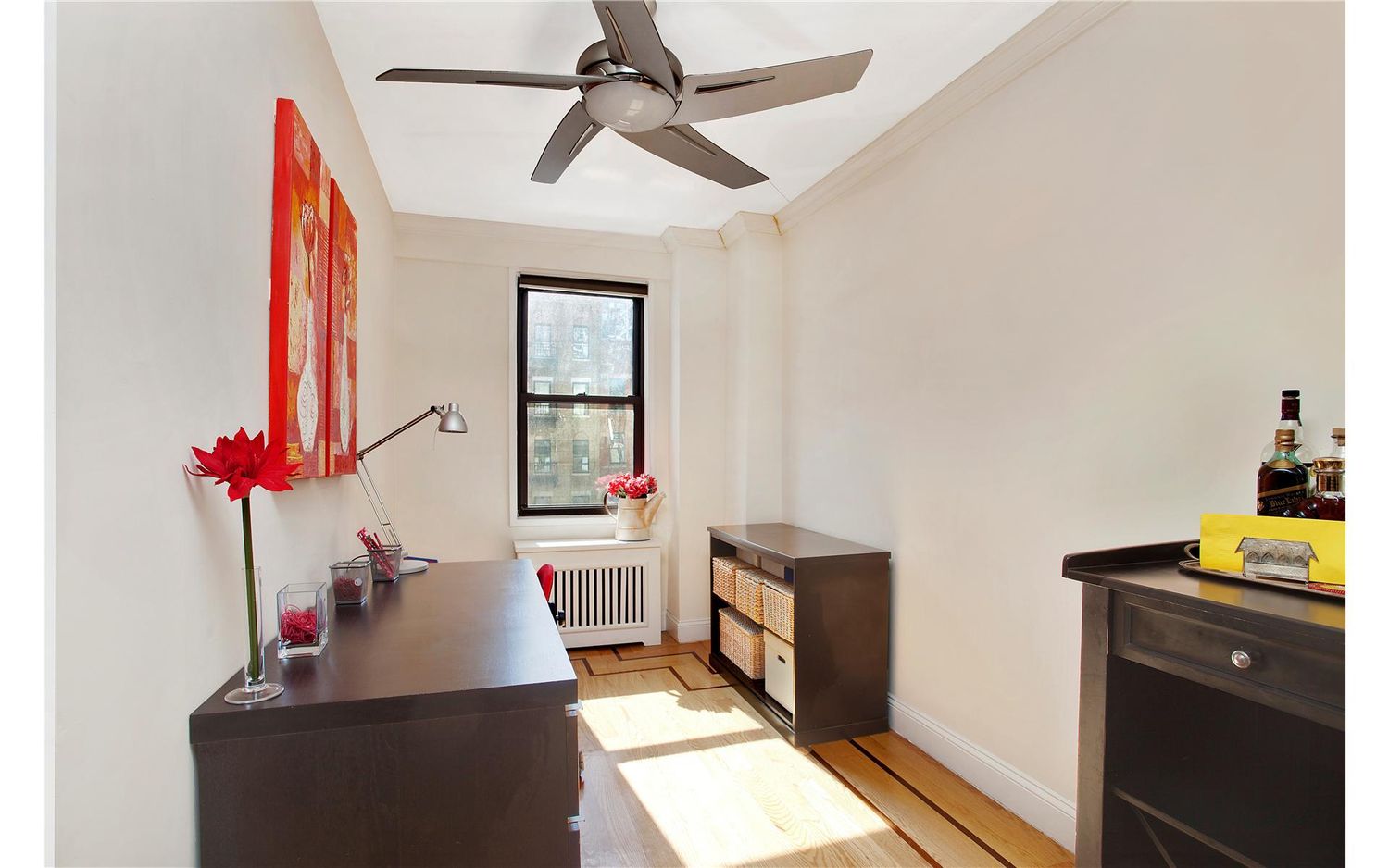 333 East 34th Street, Unit 5L Manhattan, NY 10016 - Photo 5 of 8 a living room with furniture and a window