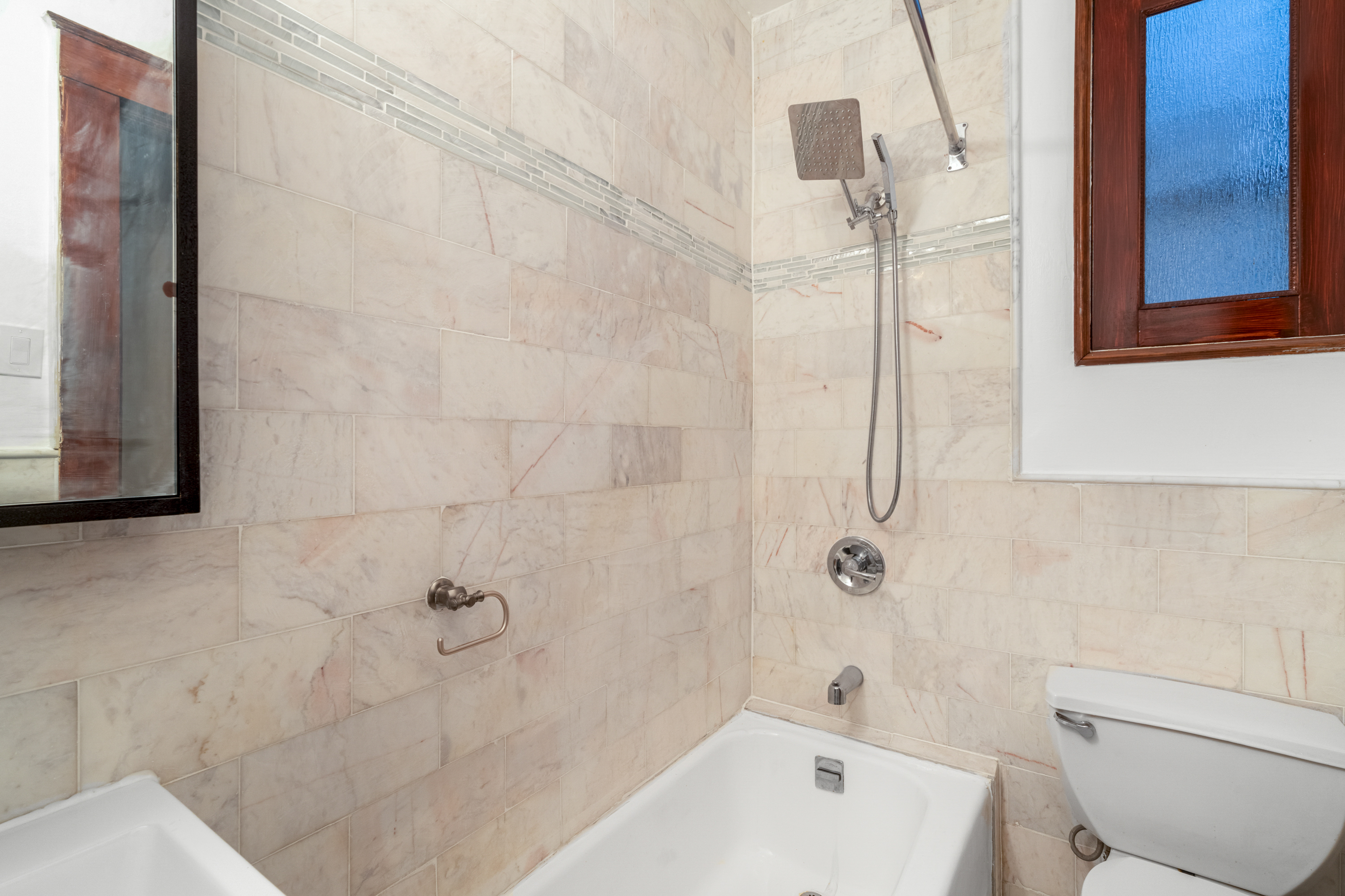 601 Jefferson Avenue, Unit 2 Brooklyn, NY 11221 - Photo 7 of 8 a bathroom with a white bath tub a toilet and a sink