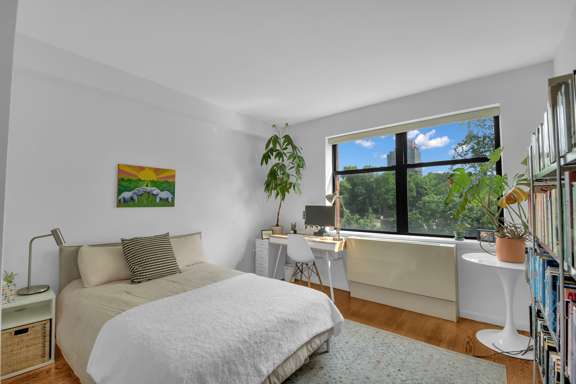 2002 5th Avenue, Unit 5B Manhattan, NY 10035 - Photo 5 of 7 a bedroom with a bed and a large window