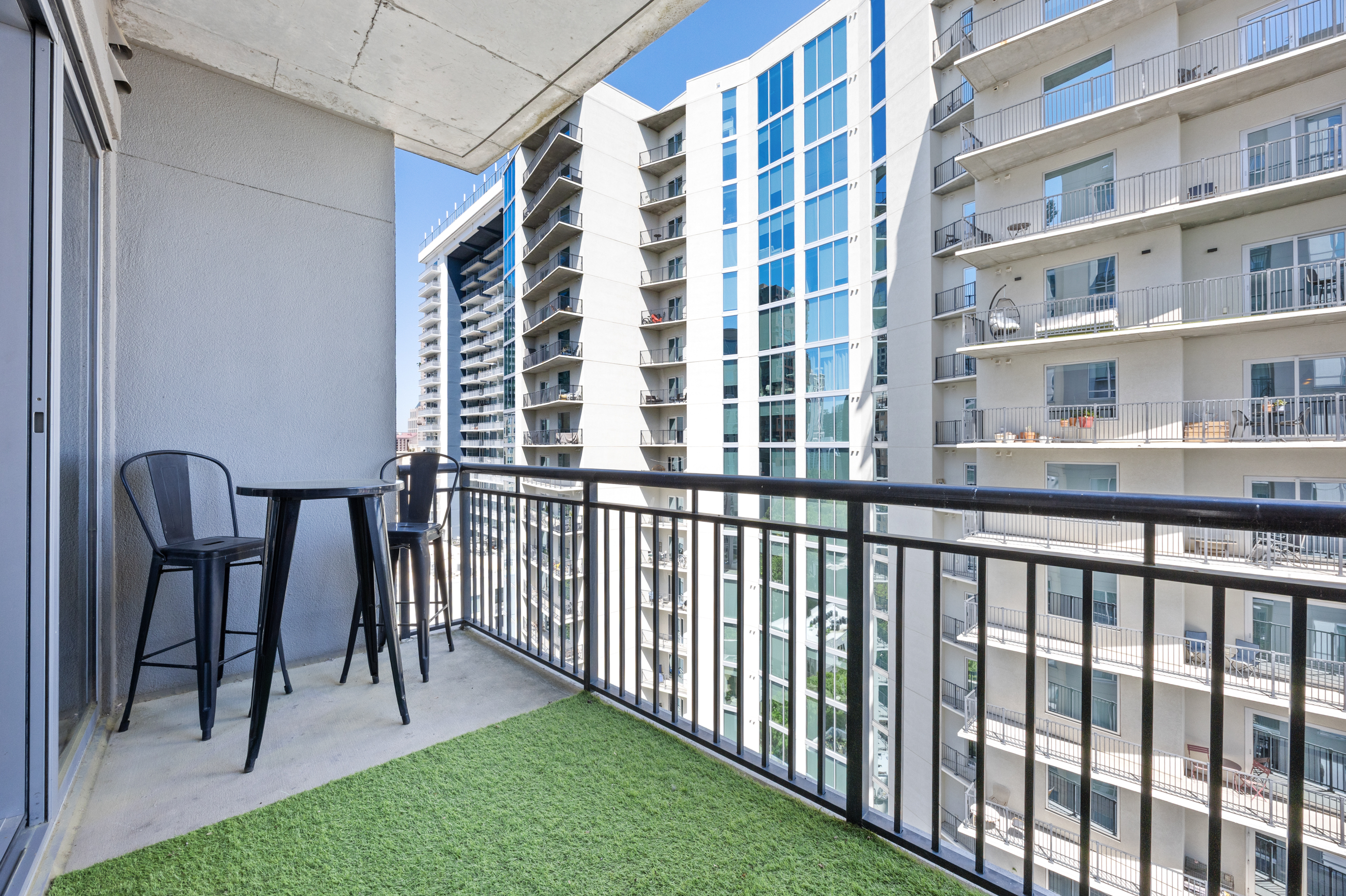 222 12th Street Northeast Atlanta, GA 30309 - Photo 24 of 56 a view of a balcony with a bench