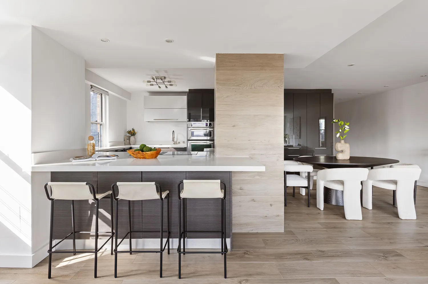 a kitchen with a table and chairs in it