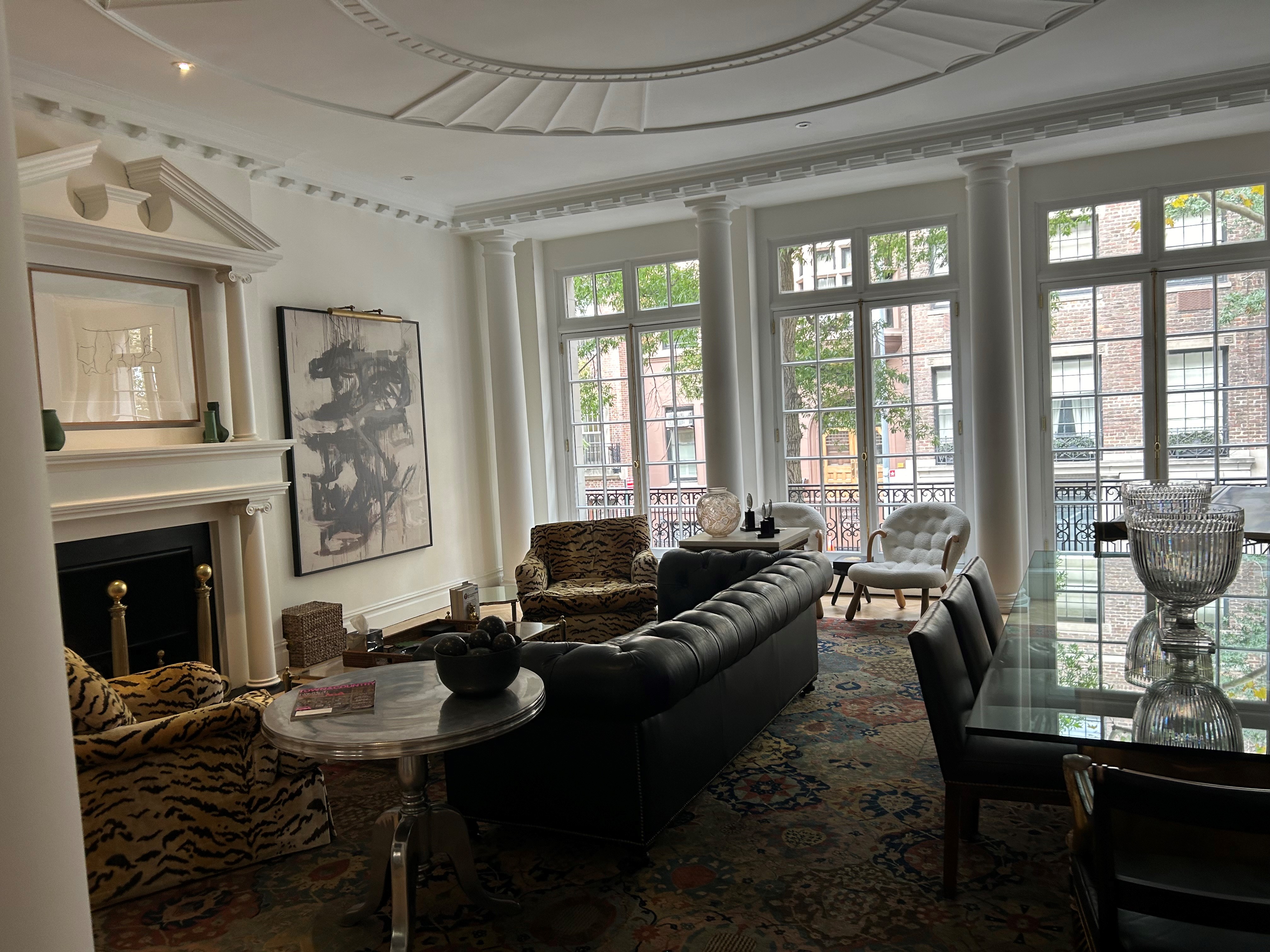 36 East 69th Street, Unit 2AB Manhattan, NY 10021 - Photo 4 of 26 a living room with furniture fireplace and a large window
