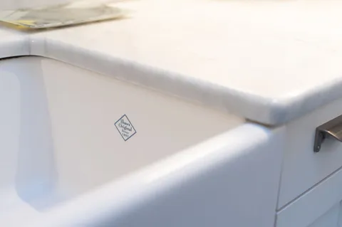 a kitchen with stainless steel appliances granite countertop a kitchen island a stove and a refrigerator