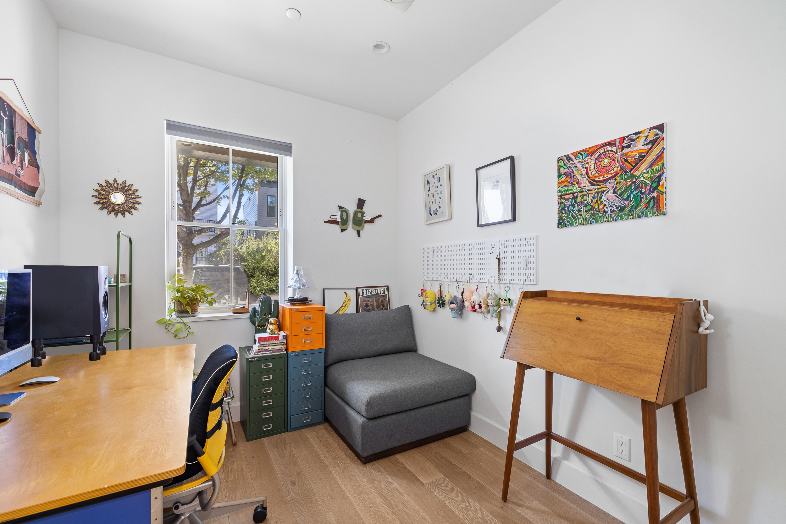 49 East 4th Street Brooklyn, NY 11218 - Photo 10 of 16 a living room with furniture and a window
