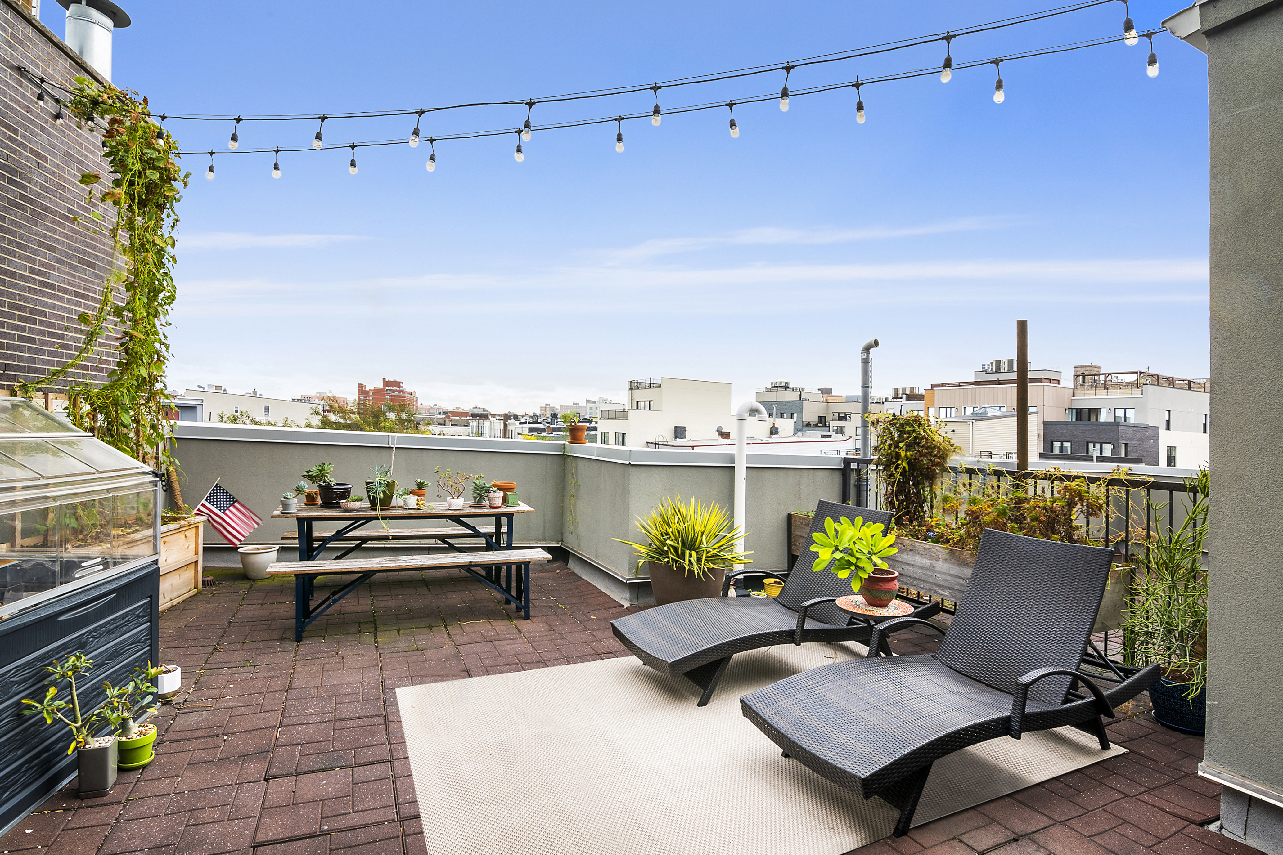 172 Wilson Avenue, Unit PHA Brooklyn, NY 11237 - Photo 10 of 14 a view of a terrace with furniture