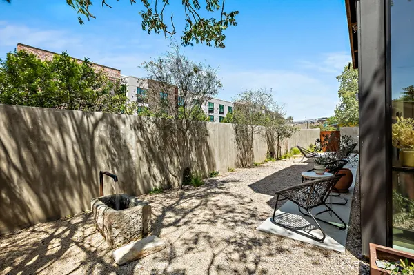 a view of backyard with patio