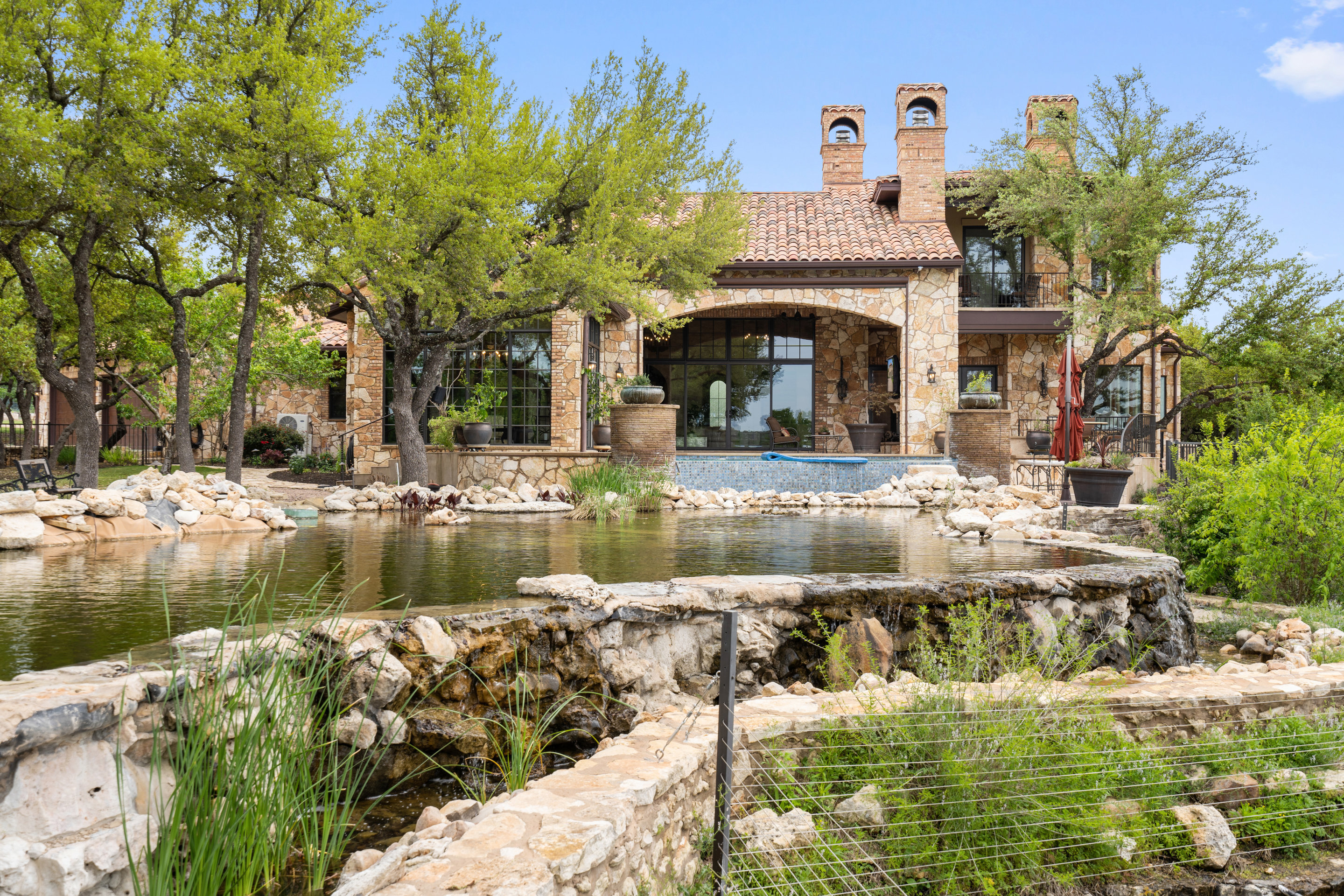 808 Rivercliff Drive Spicewood, TX 78669 - Photo 29 of 71 a front view of a house with a yard