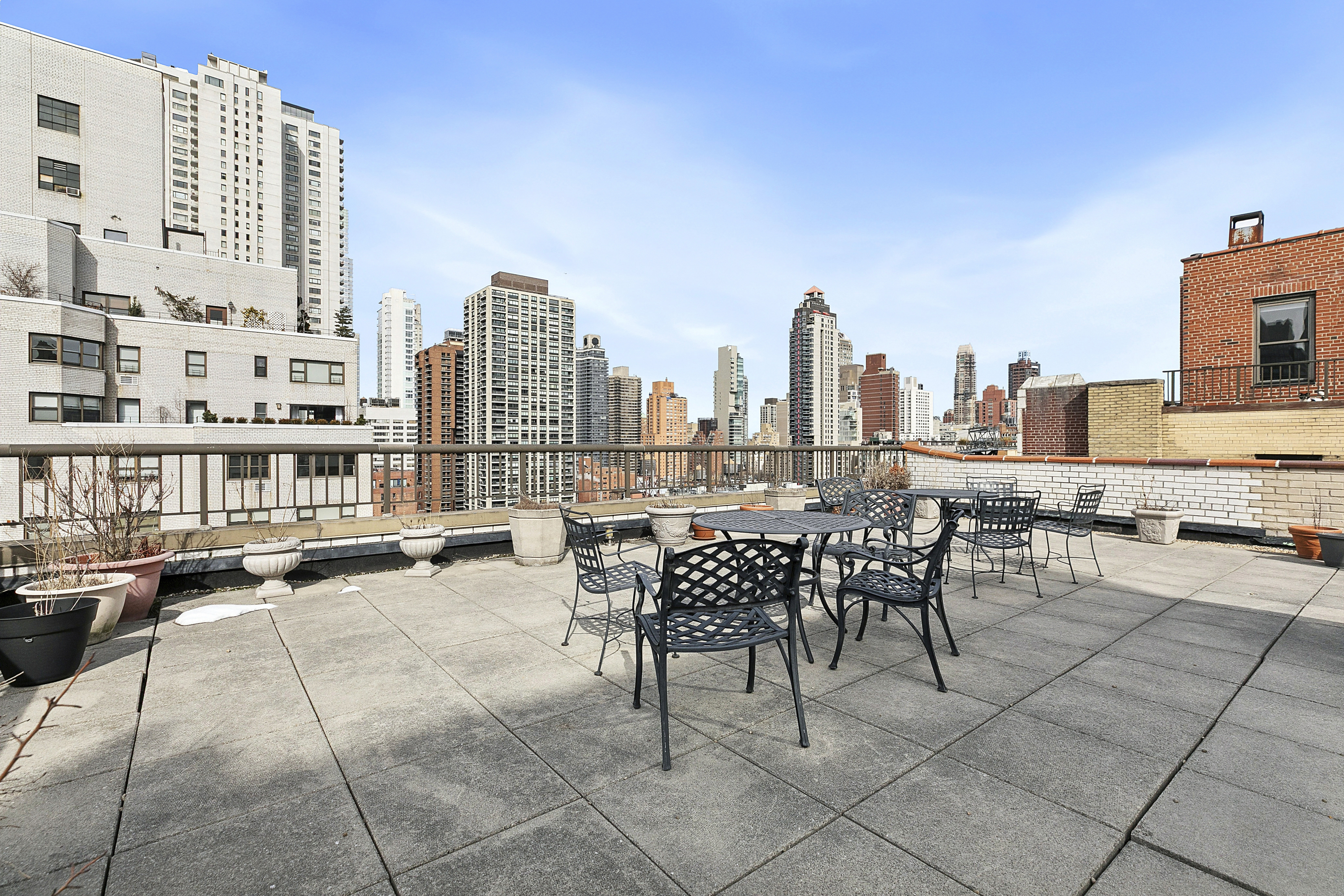 411 East 57th Street, Unit 14F Manhattan, NY 10022 - Photo 7 of 8 a view of a terrace with chairs