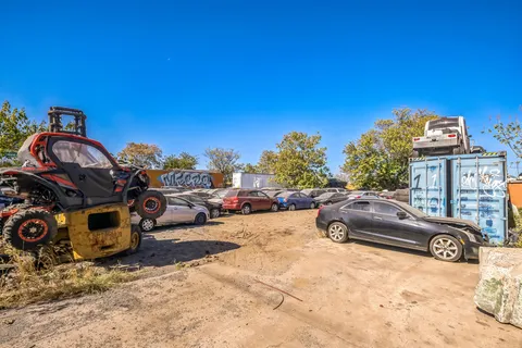 a view of a street with cars parked