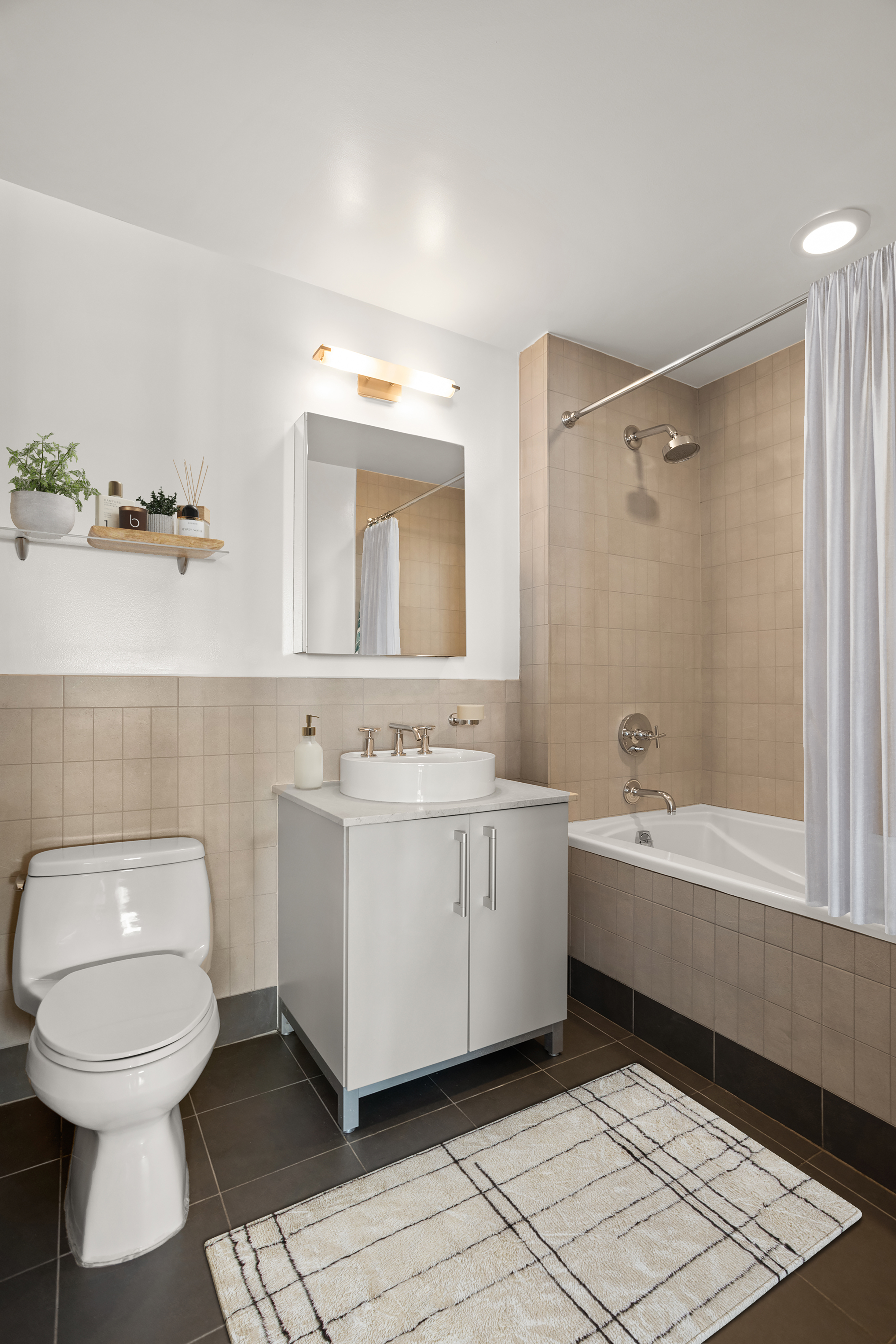 199 State Street, Unit 4C Brooklyn, NY 11201 - Photo 7 of 9 a bathroom with a sink a toilet and shower