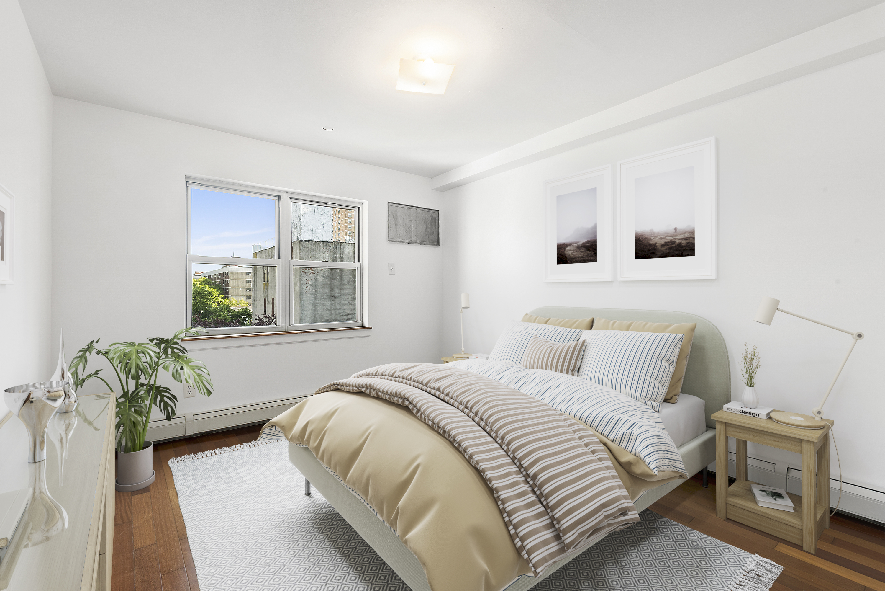 122 Boerum Street, Unit 4R Brooklyn, NY 11206 - Photo 5 of 9 a bedroom with a bed and window