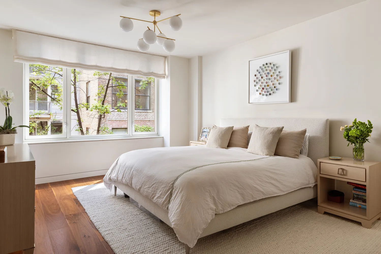 a bedroom with bed and a large window
