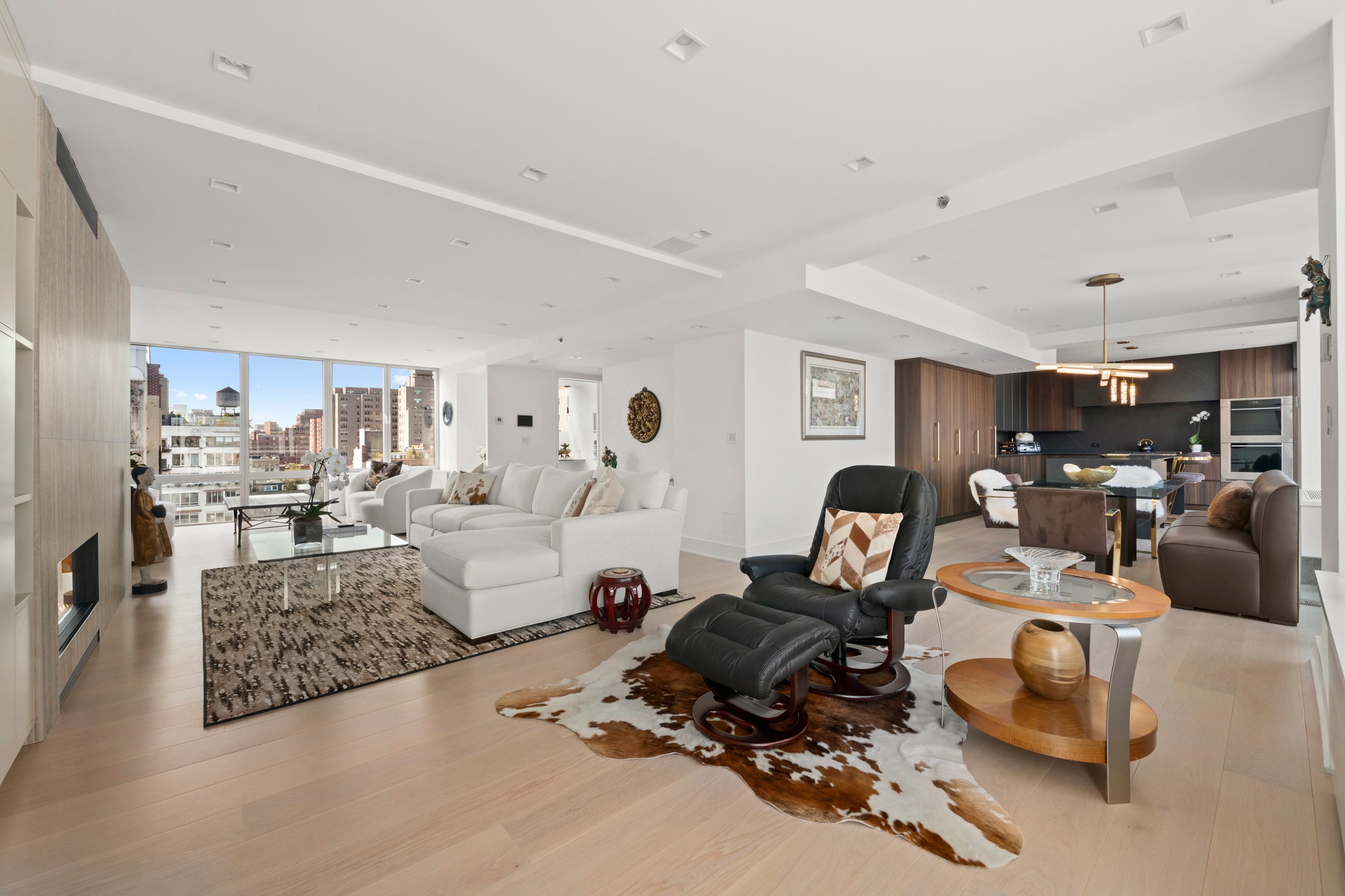 151 West 17th Street, Unit PHF Manhattan, NY 10011 - Photo 2 of 19 a living room with furniture or couch and a table