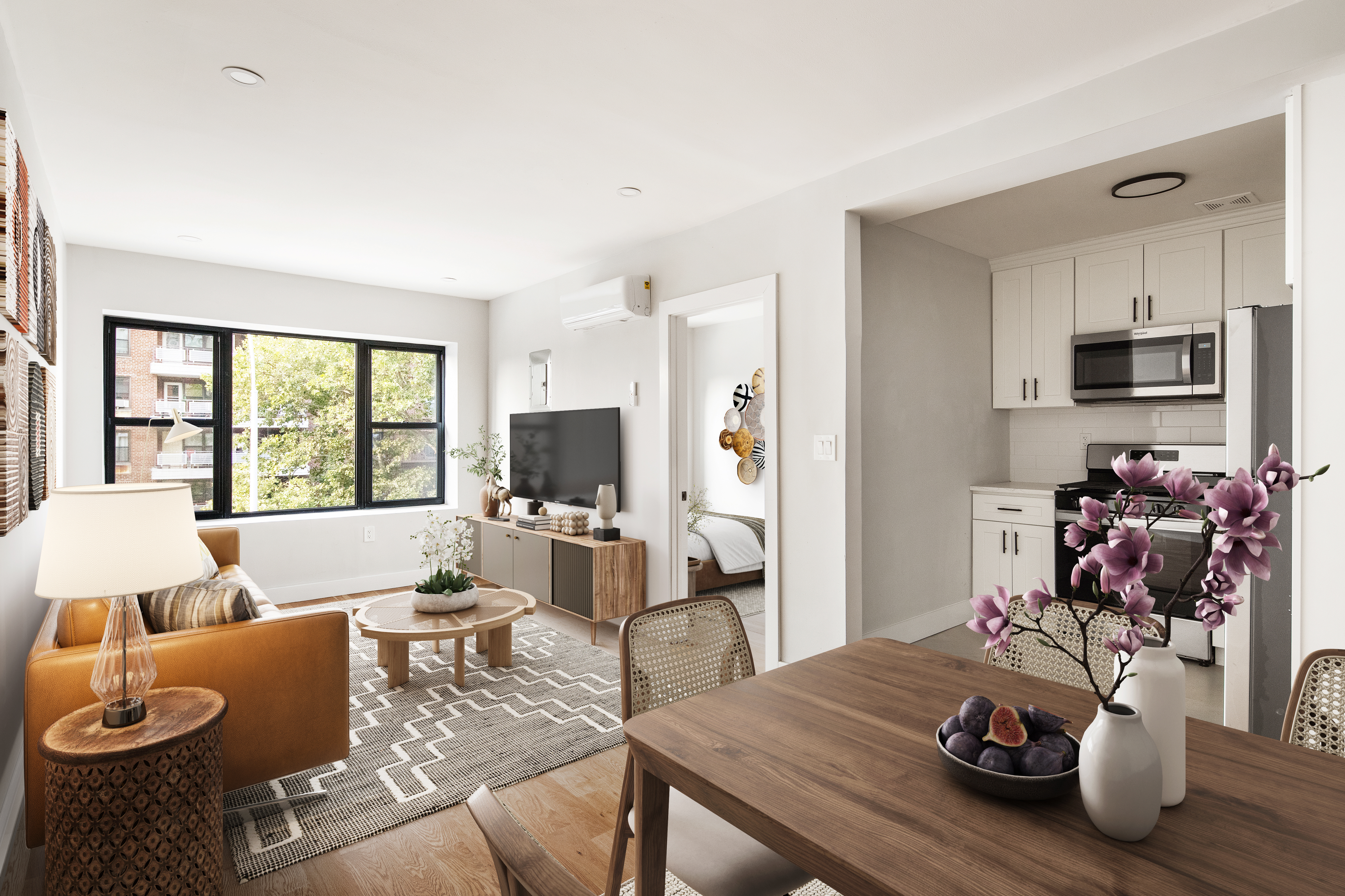 a living room with furniture a flat screen tv and a window