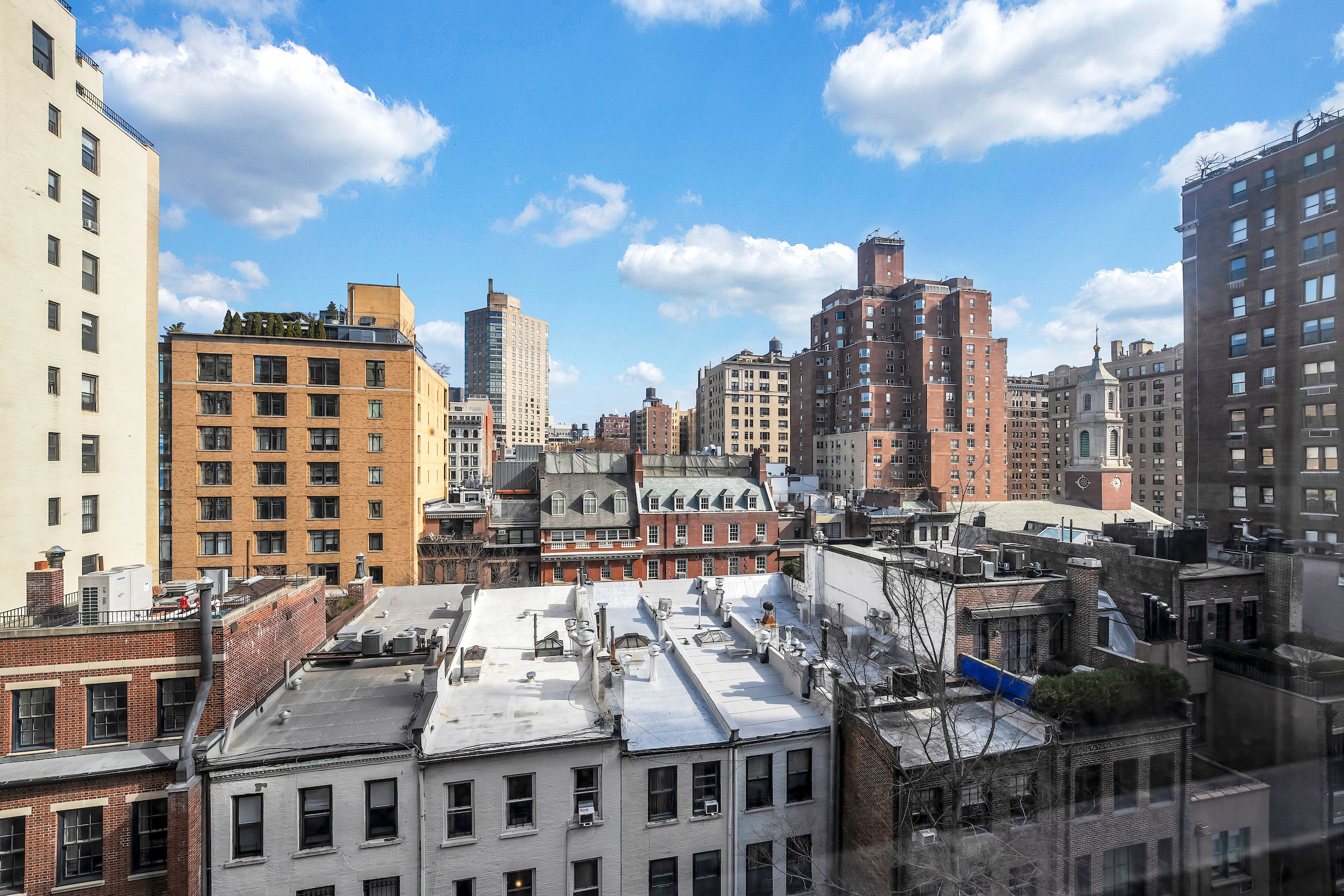 51 East 90th Street, Unit 8D Manhattan, NY 10128 - Photo 7 of 10 a city view with tall buildings