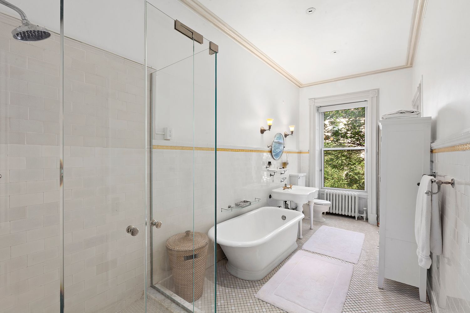 16 East 74th Street, Unit 4/5 Manhattan, NY 10021 - Photo 8 of 13 a bathroom with a tub shower and sink