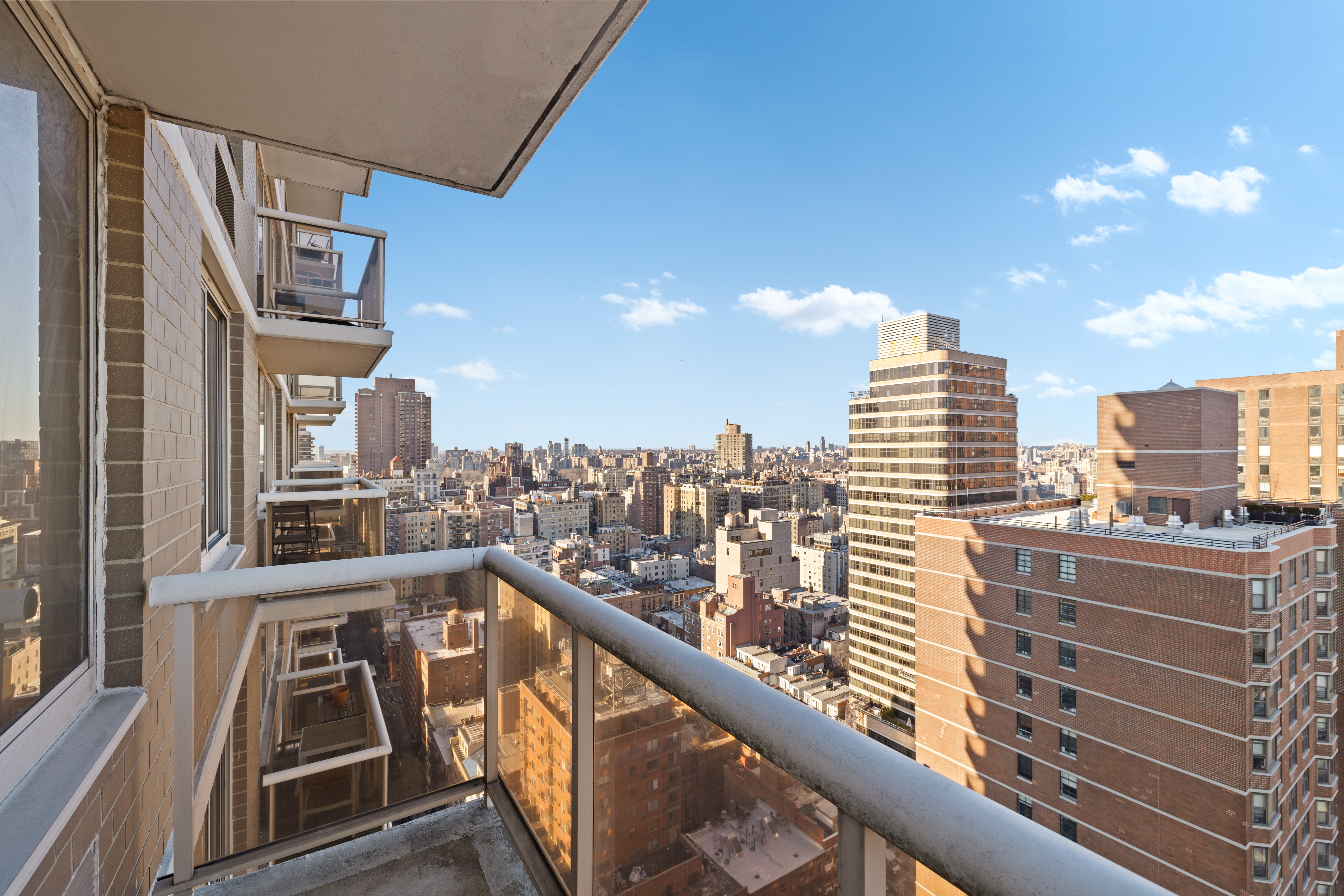 200 East 89th Street, Unit 29D Manhattan, NY 10128 - Photo 9 of 16 a view of a balcony with city view