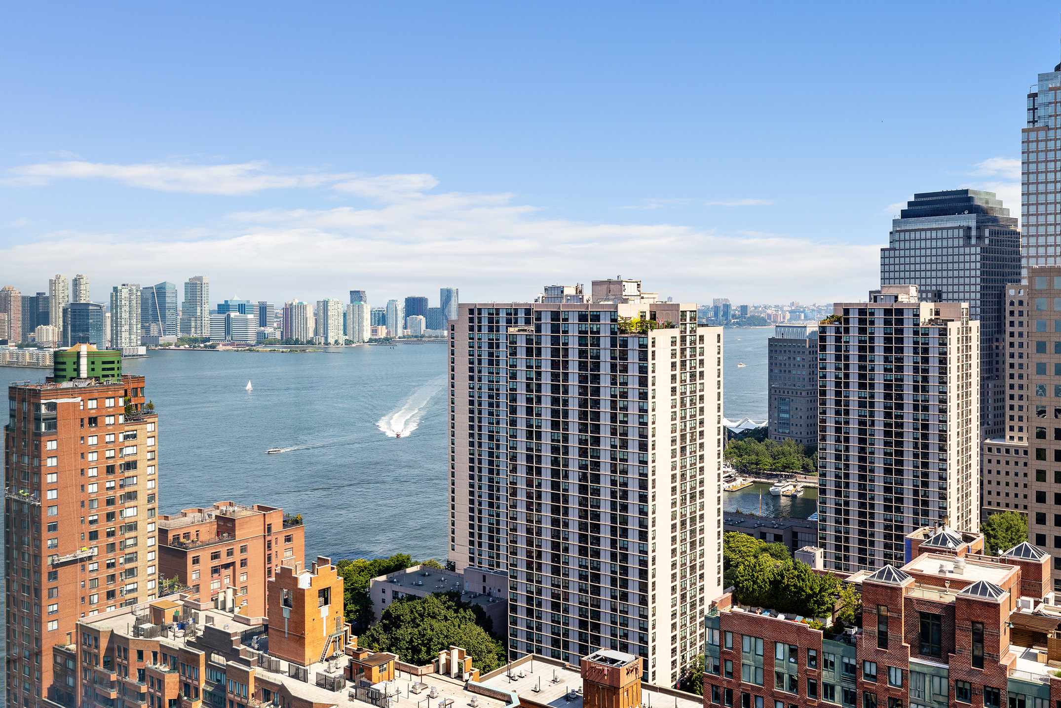200 Rector Place, Unit 36LM Manhattan, NY 10280 - Photo 5 of 15 a view of a city with tall buildings