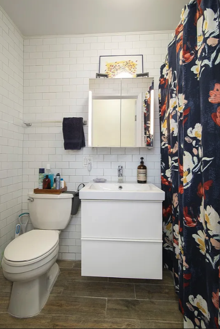 1275 Nostrand Avenue, Unit 3L Brooklyn, NY 11226 - Photo 6 of 6 a bathroom with a sink mirror vanity and toilet