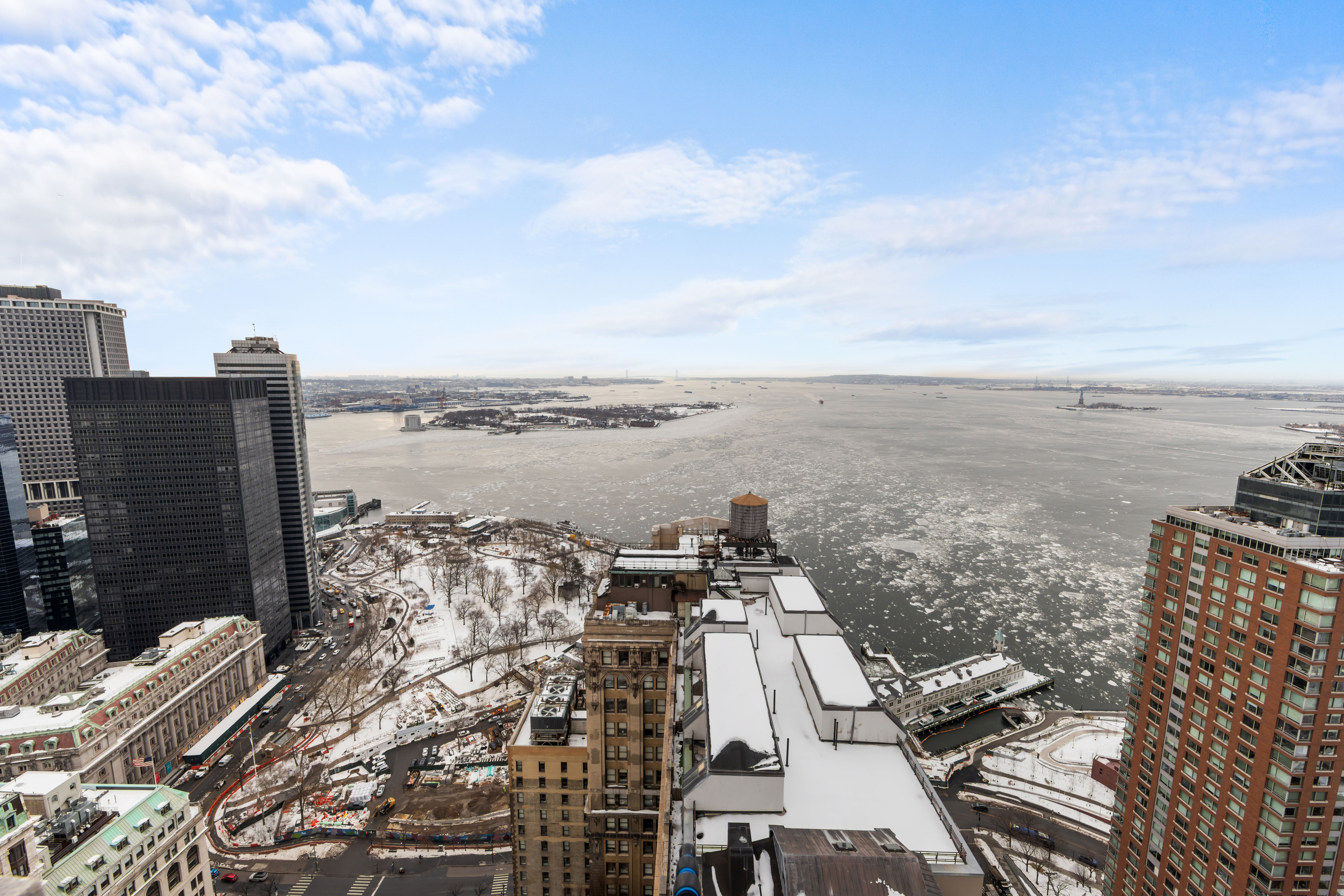 20 West Street, Unit 41D Manhattan, NY 10004 - Photo 14 of 17 a view of a city with ocean