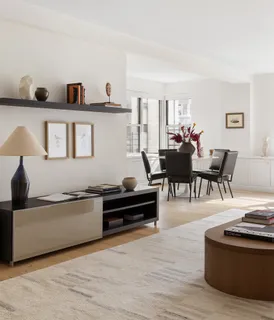 a kitchen with a sink a stove and cabinets