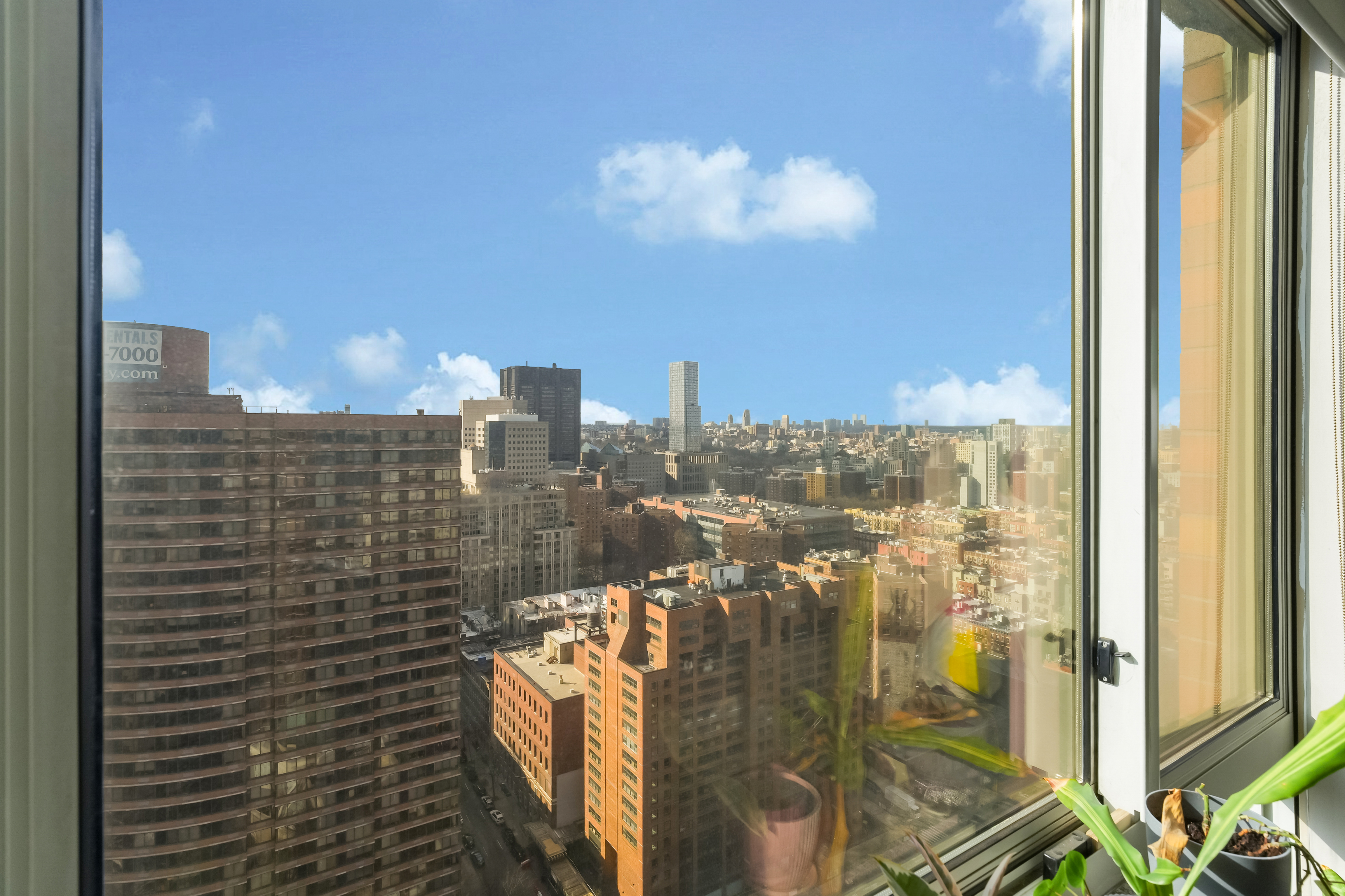 215-217 East 96th Street, Unit 32F Manhattan, NY 10128 - Photo 5 of 8 a view of a city from a balcony