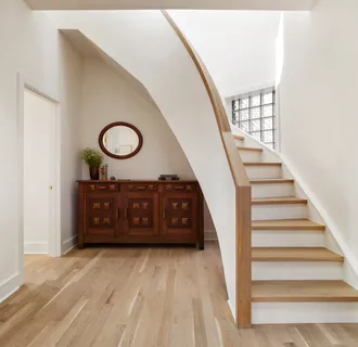a view of a hallway with entryway wooden floor and front door