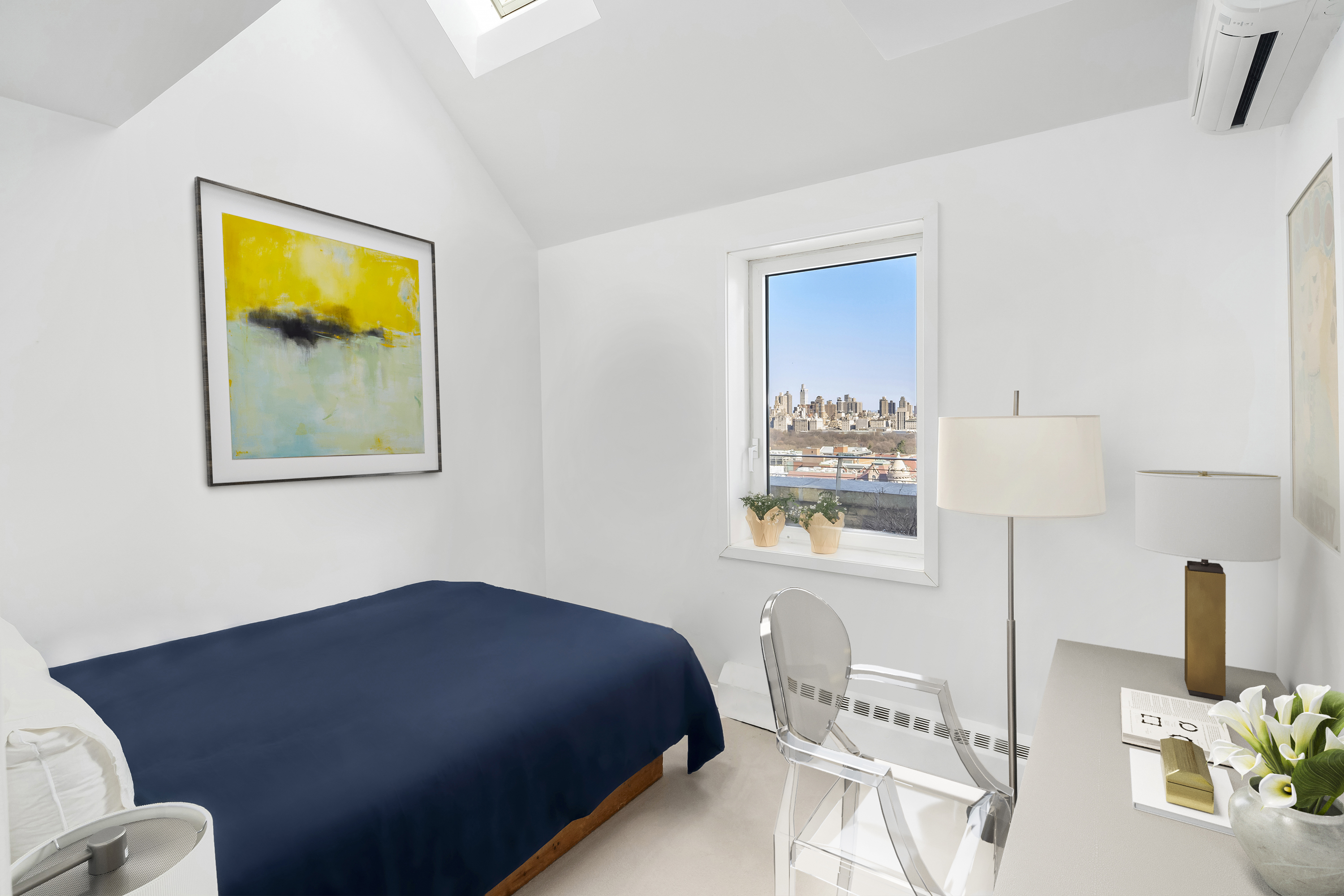 2166 Broadway, Unit PH Manhattan, NY 10024 - Photo 19 of 37 a bedroom with a bed and a lamp on dresser