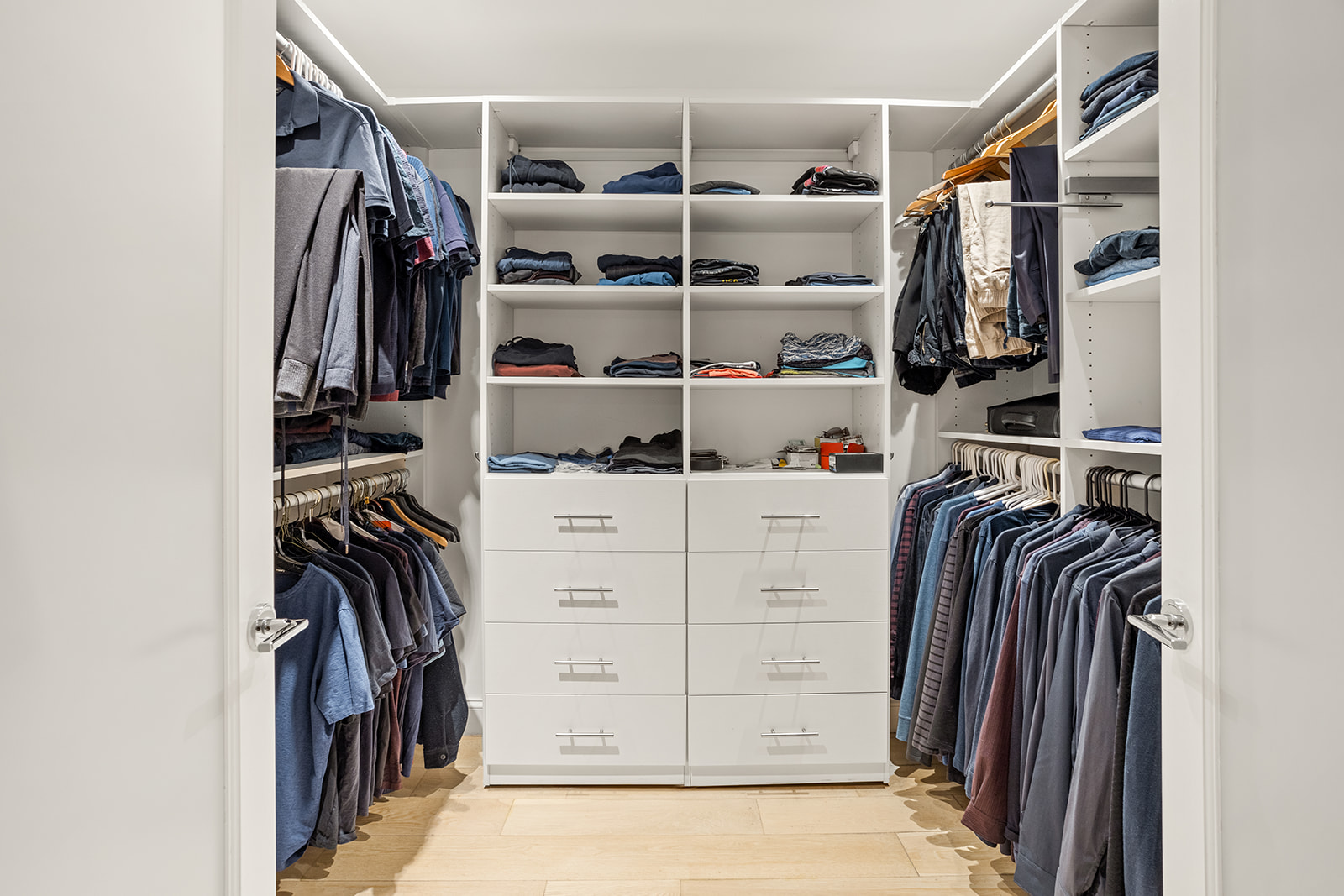 125 East 12th Street, Unit 1E Manhattan, NY 10003 - Photo 13 of 16 a view of walk in closet with clothes and shoes