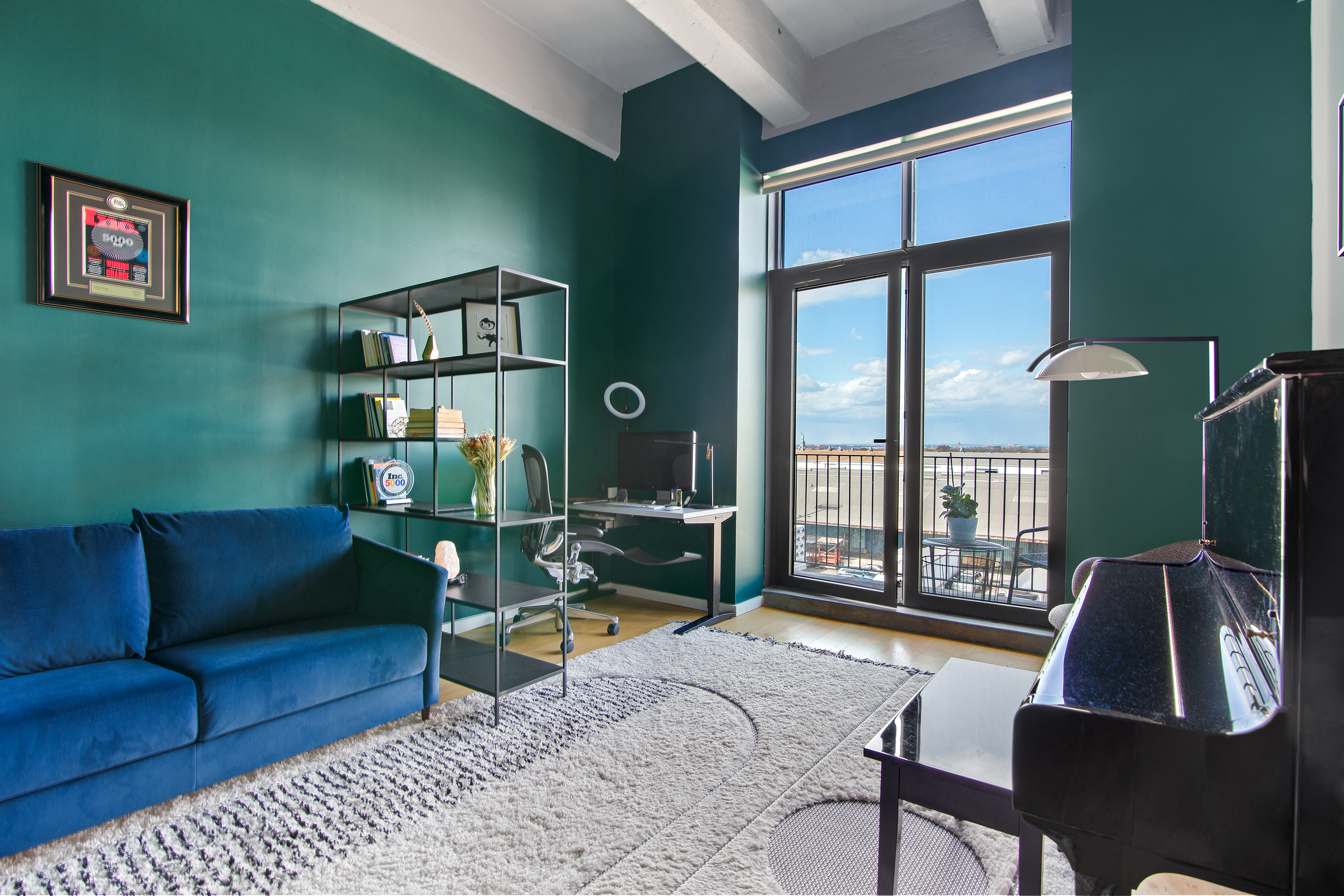 160 Imlay Street, Unit 4E2 Brooklyn, NY 11231 - Photo 4 of 8 a living room with furniture wooden floor and a floor to ceiling window
