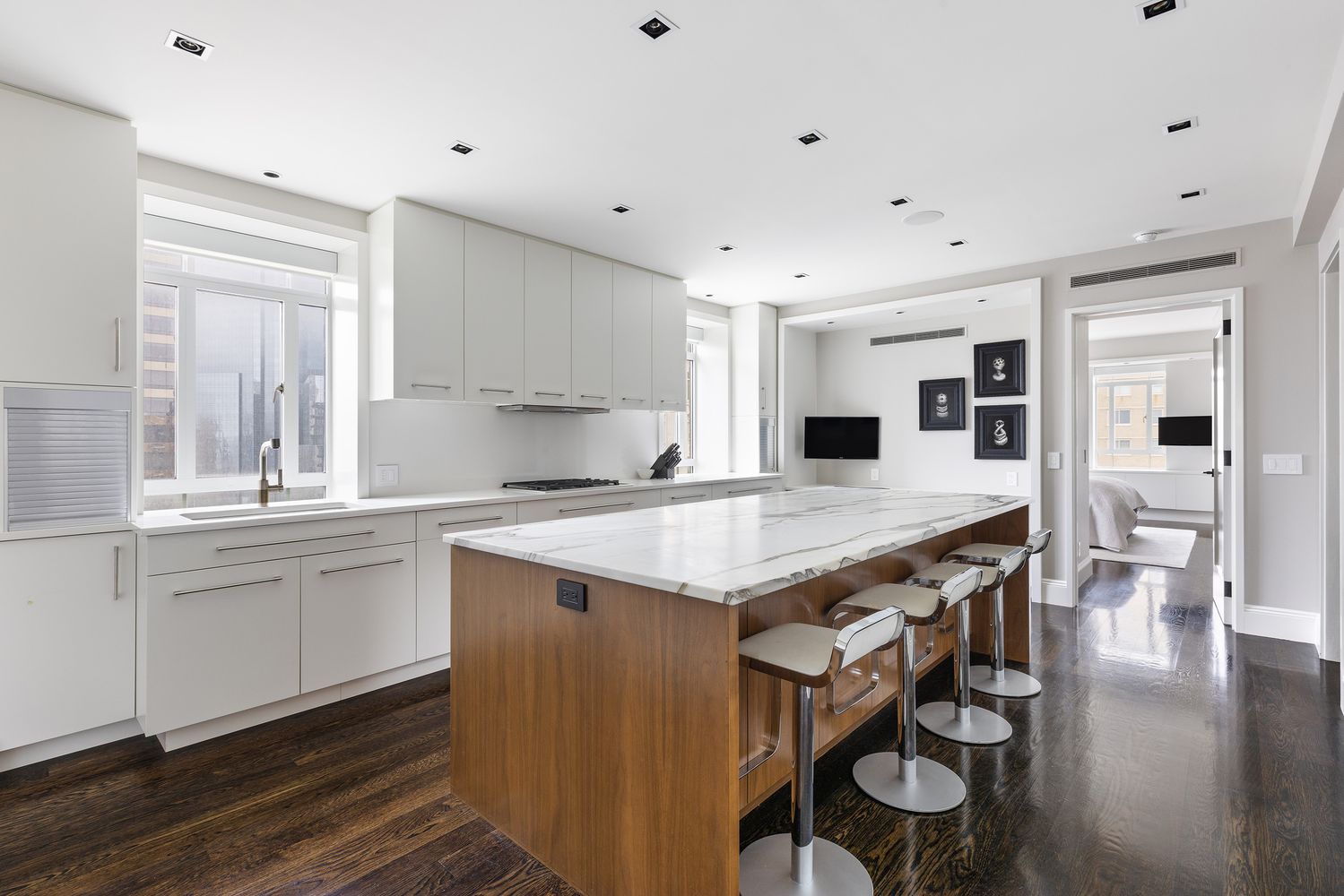 25 Central Park West, Unit 27J Manhattan, NY 10023 - Photo 7 of 13 a open kitchen with stainless steel appliances granite countertop a stove and a sink