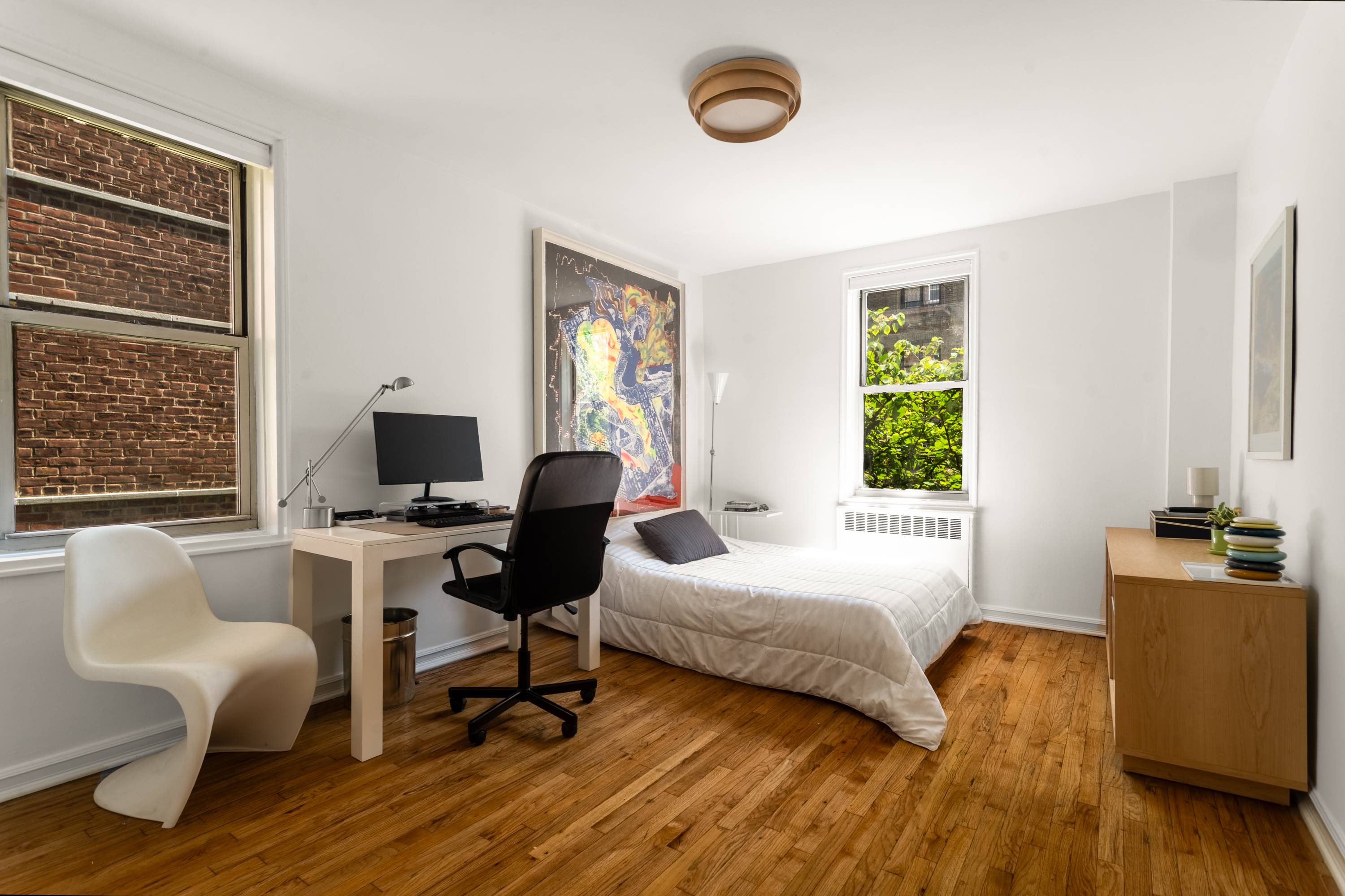 340 Haven Avenue, Unit 2H Manhattan, NY 10033 - Photo 7 of 24 a bedroom with a bed and a desk