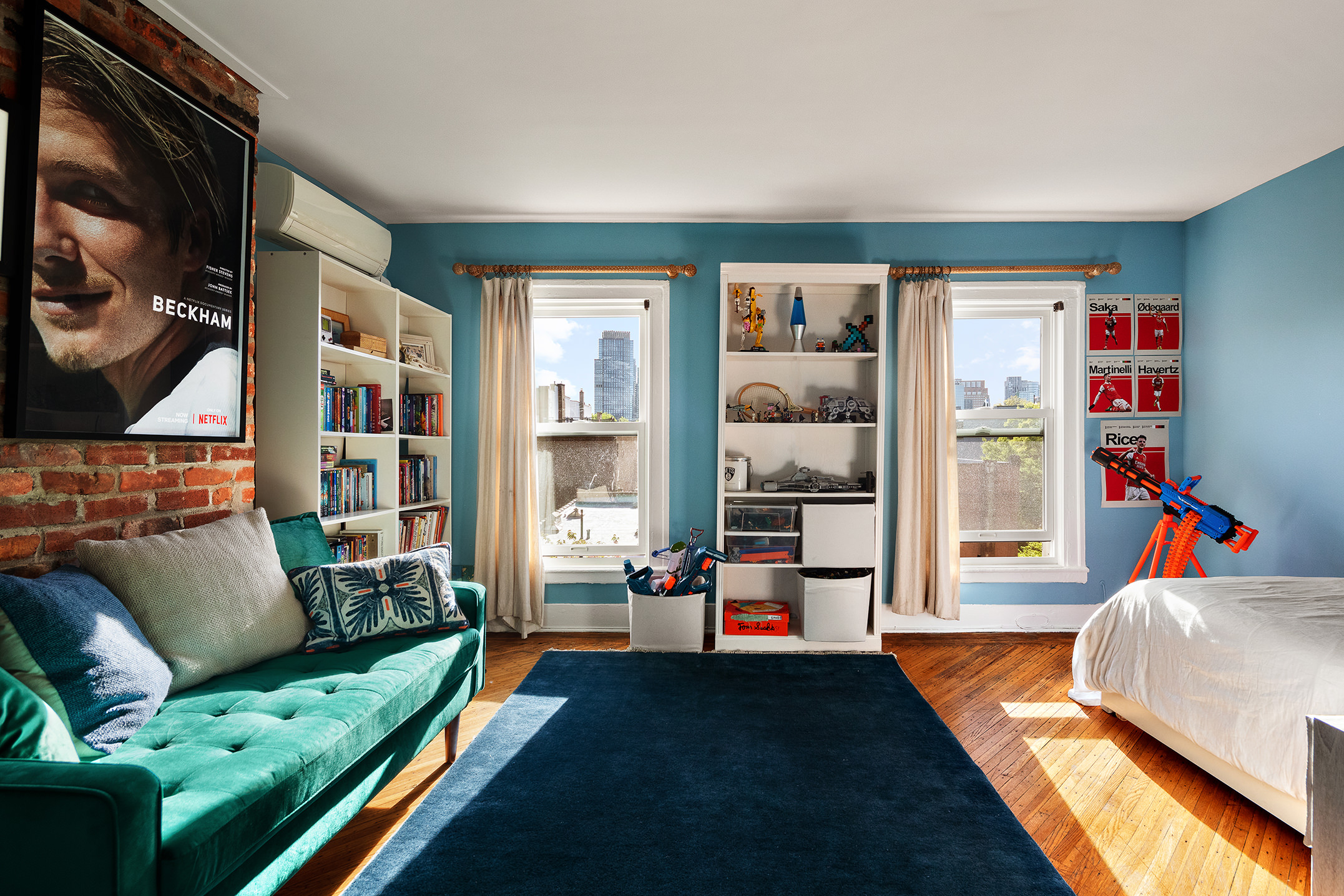 264 Clinton Avenue Brooklyn, NY 11205 - Photo 15 of 21 a living room with furniture and a book shelf