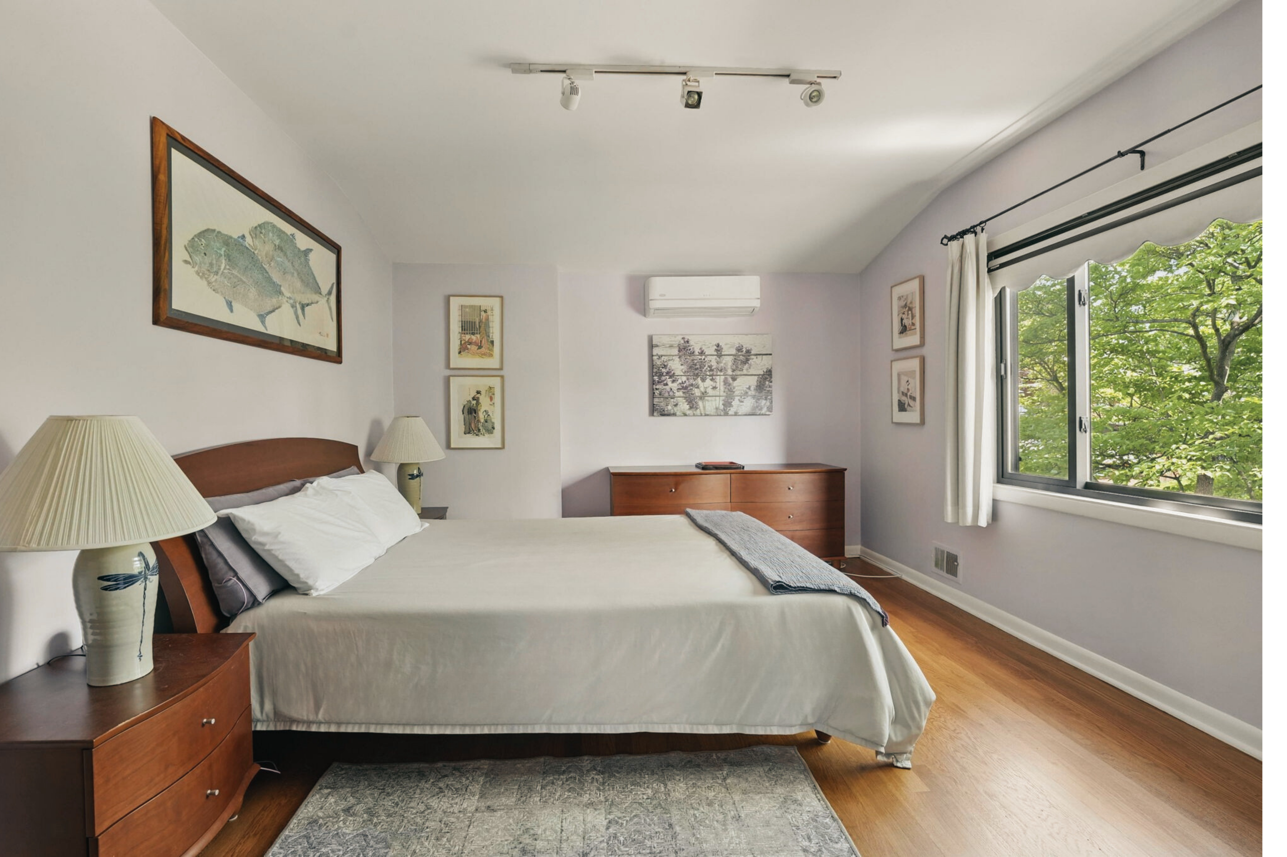 8003 16th Street Northwest Washington, DC 20012 - Photo 34 of 38 a bedroom with a bed two lamps and a large window