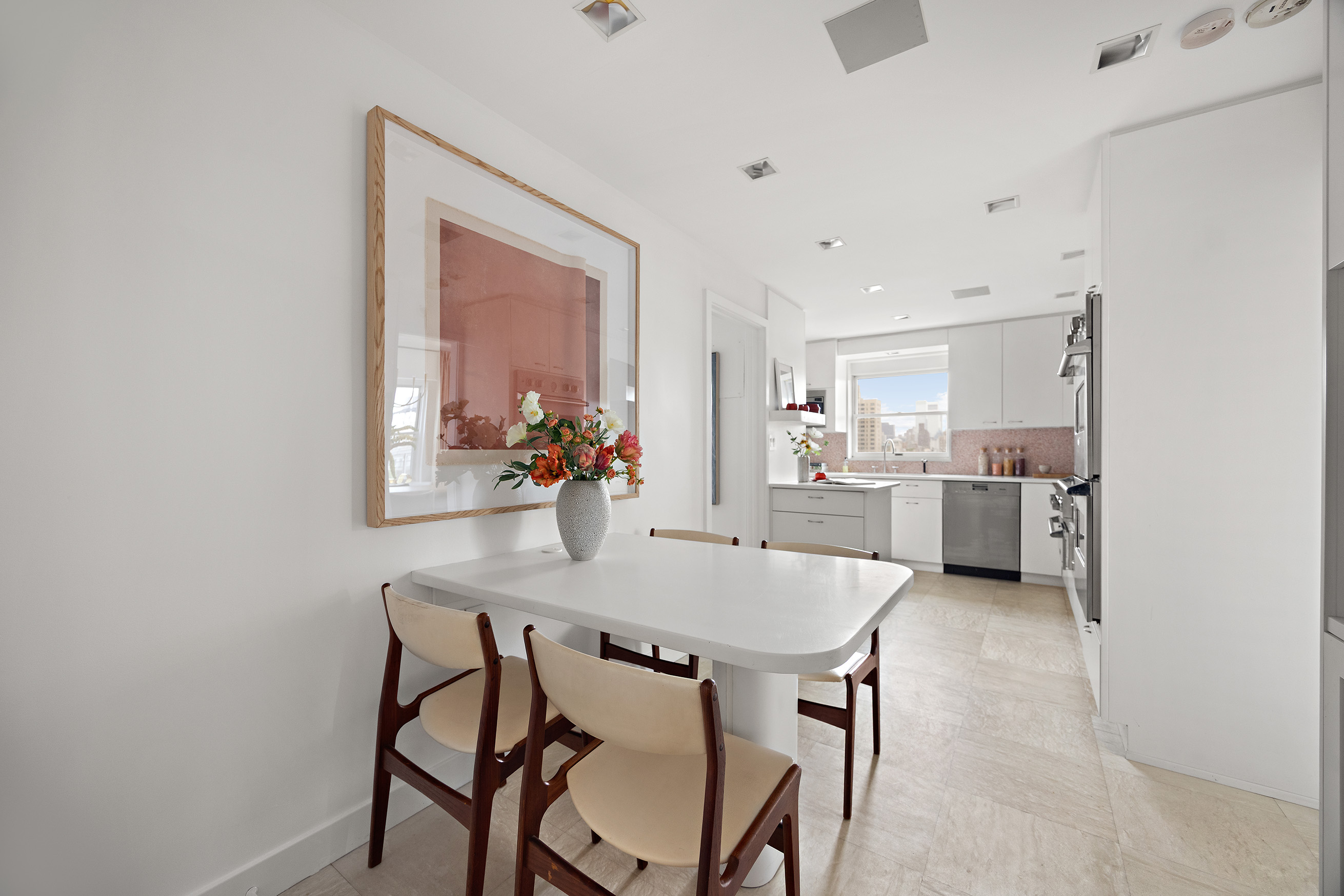 40 East 84th Street, Unit 17A Manhattan, NY 10028 - Photo 7 of 16 a view of a dining room with furniture and window