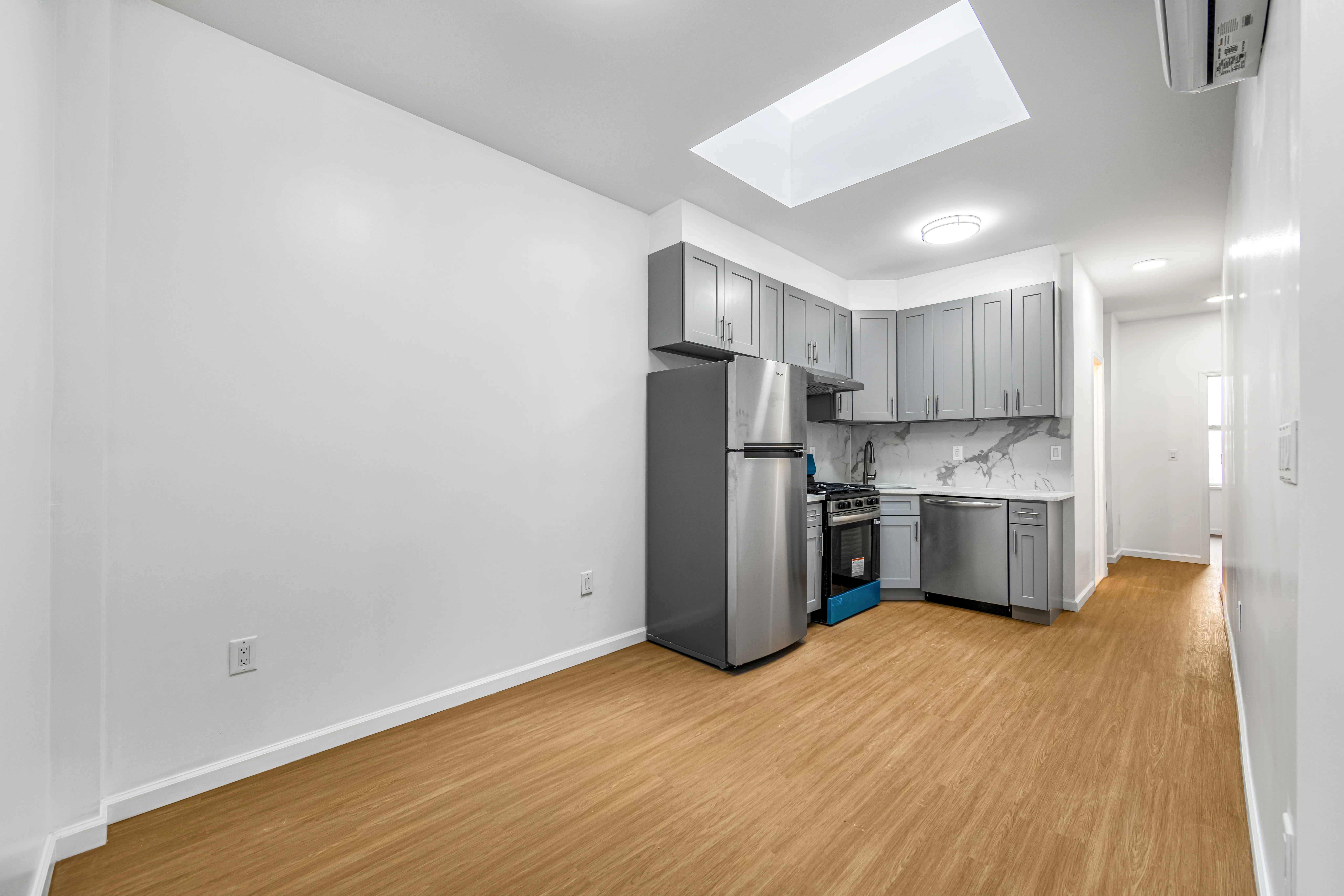 a kitchen with stainless steel appliances a refrigerator and a sink