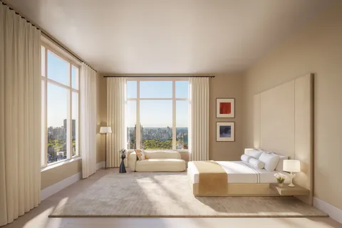 a living room with furniture and large windows