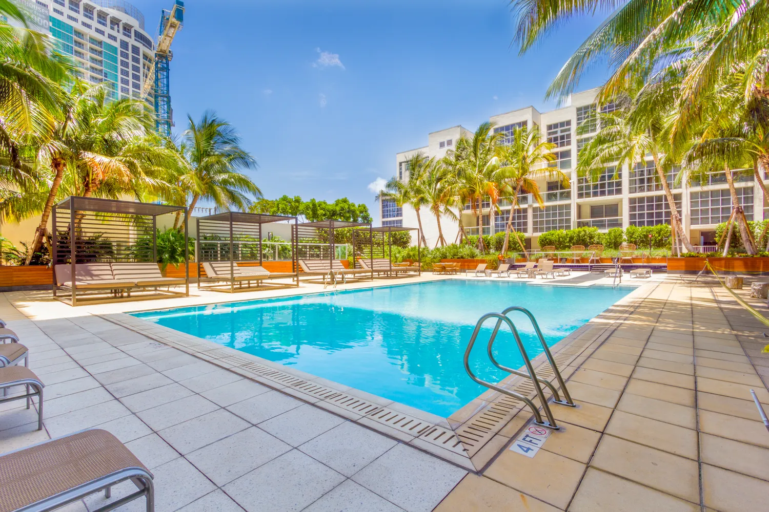 a view of a swimming pool with a lounge chairs