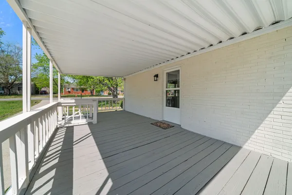 a view of outdoor space with wooden floor and yard