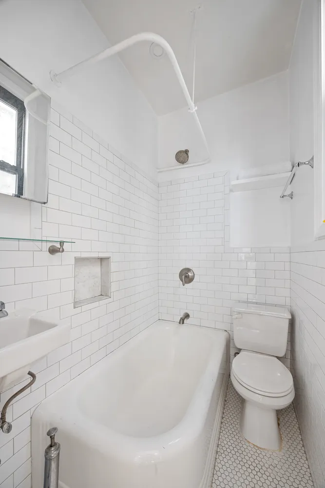 a bathroom with a toilet and a bathtub