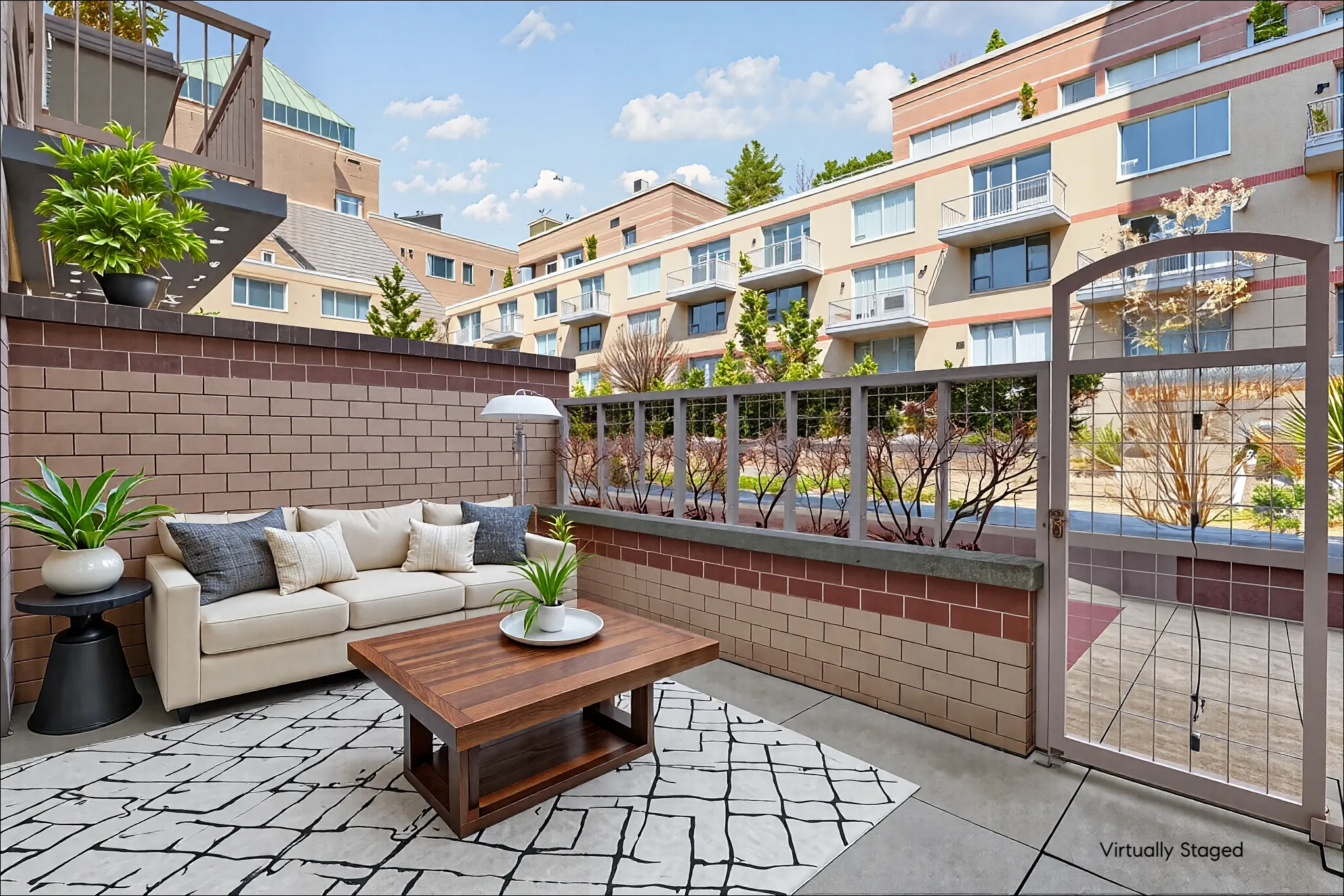 350 West 50th Street, Unit 2DD Manhattan, NY 10019 - Photo 1 of 7 a view of a patio with couches and potted plants