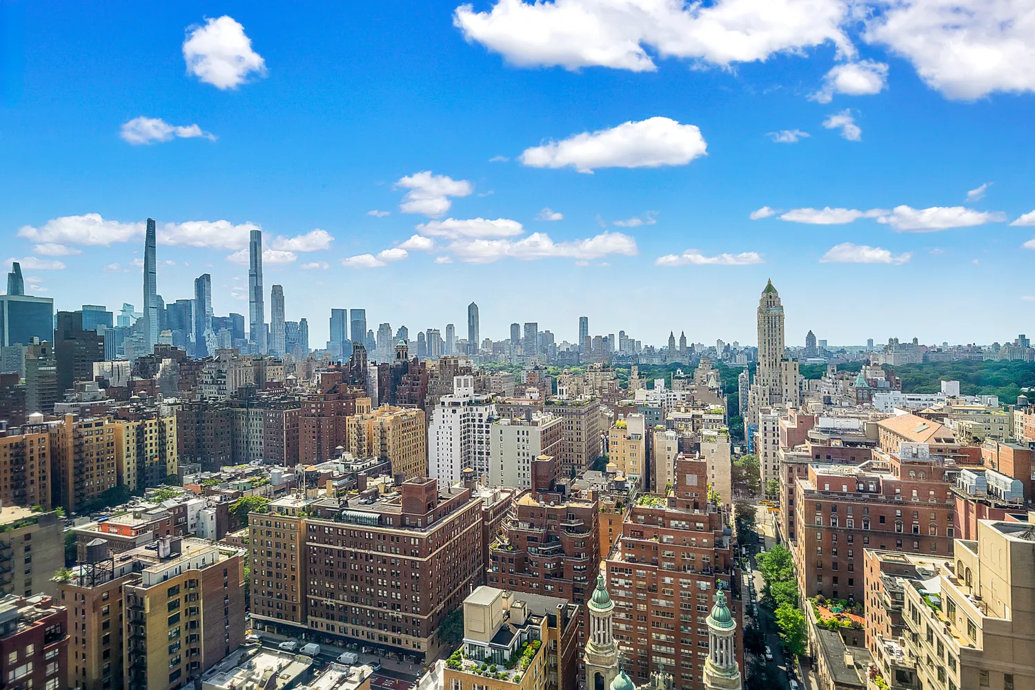a view of a city with tall buildings