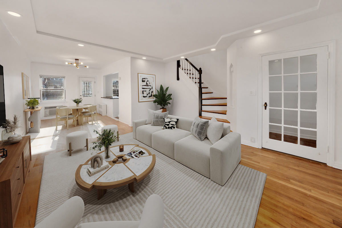 82-56 Eliot Avenue Queens, NY 11379 - Photo 2 of 7 a living room with furniture and a wooden floor